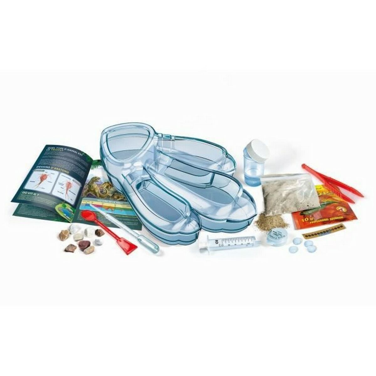 Einige wissenschaftliche Spielzeuge, darunter eine Lupe, eine Spritze und Sand.