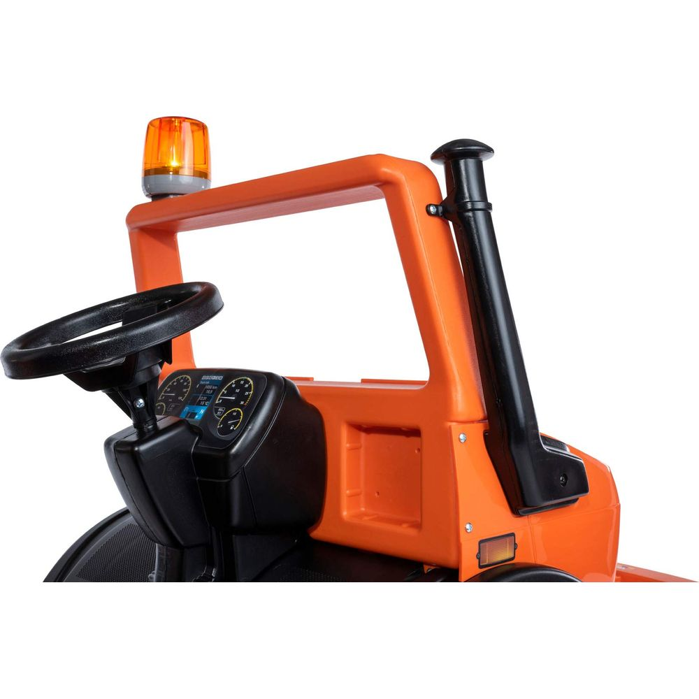 Orangefarbener Spielzeug-Traktor mit Lenkrad, Armaturenbrett und Warnleuchte.