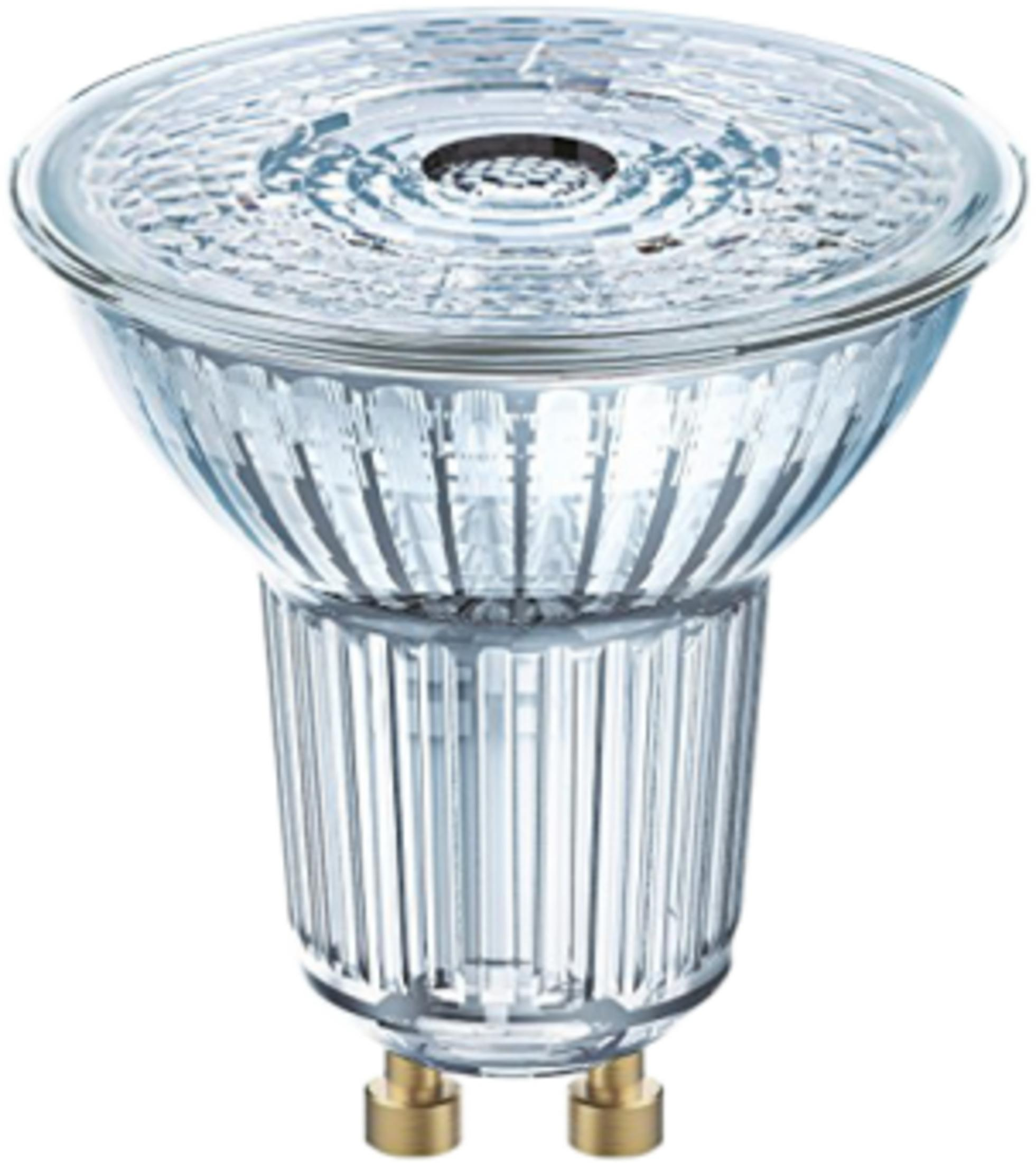 Eine durchsichtige Glühbirne mit geripptem Glaskolben und zwei goldenen Stiften.