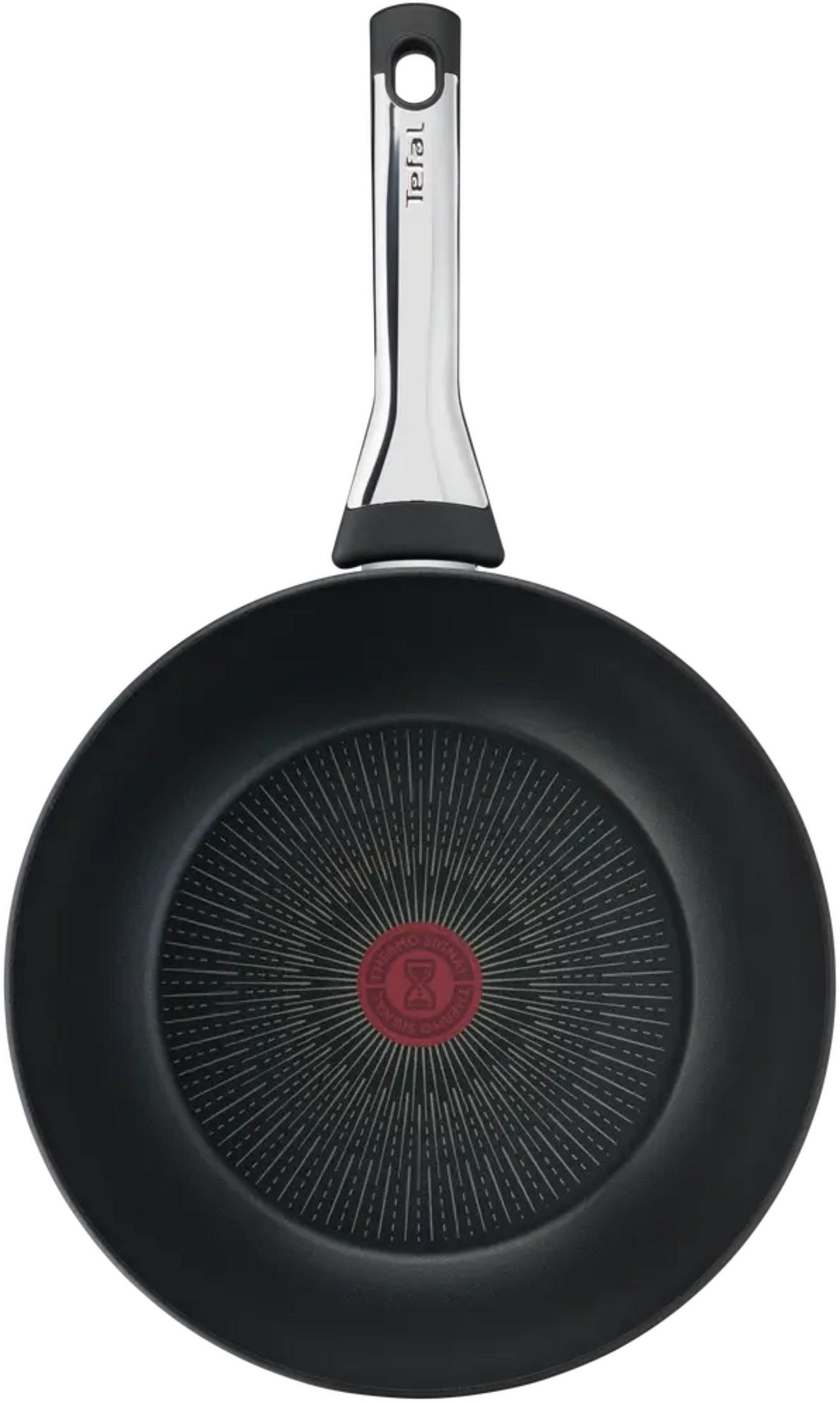 Czarna patelnia ze srebrną rączką i czerwonym wskaźnikiem Thermo-Signal.