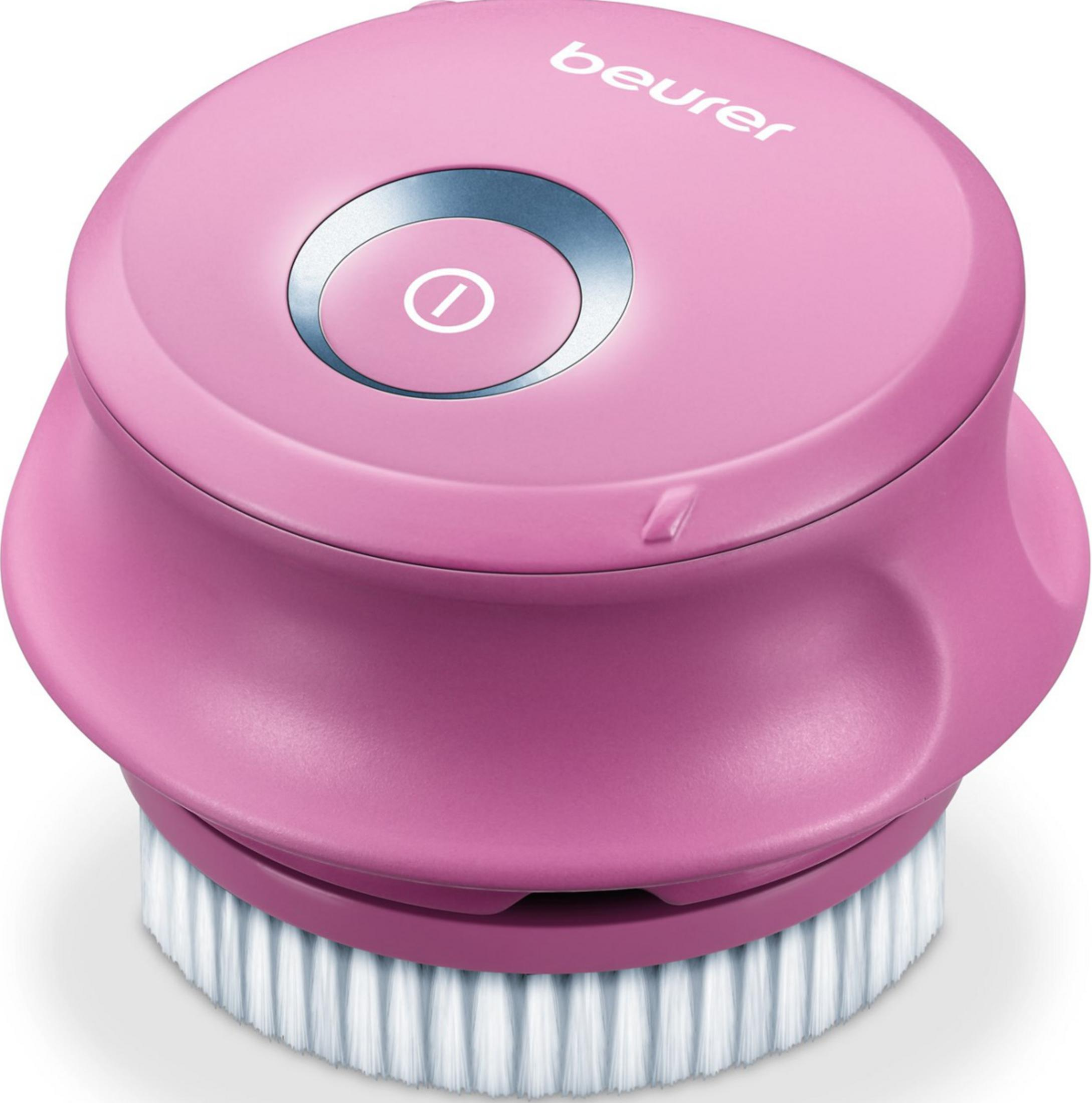 Un cepillo rosa eléctrico para limpieza facial con un botón plateado.