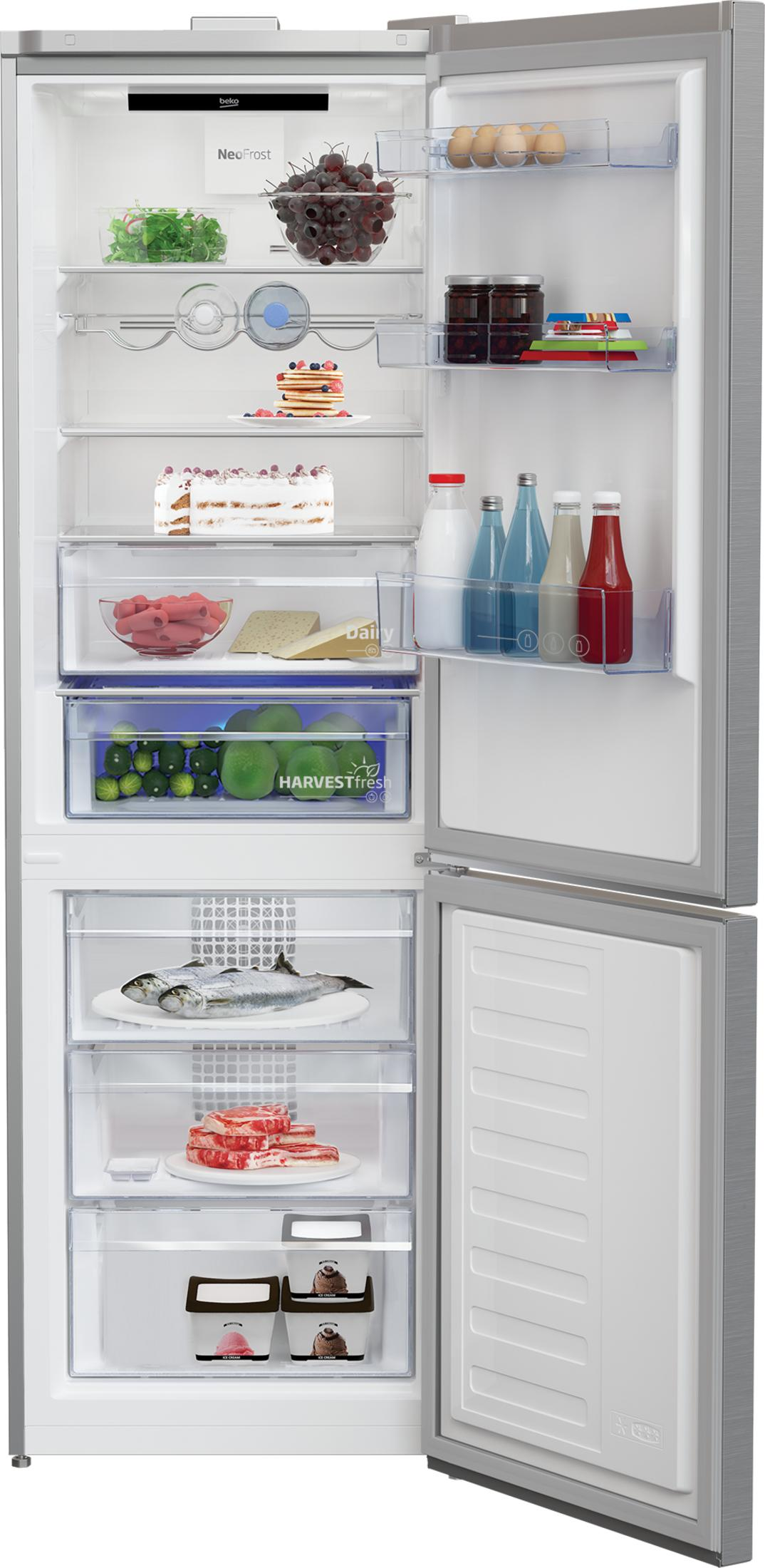 Frigorifero aperto pieno di cibo: frutta, torta, pesce, carne, gelato, uova e bevande.