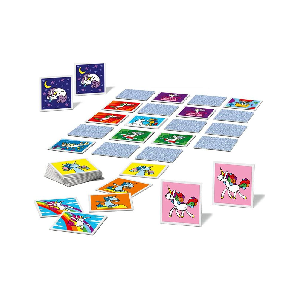Widok gry karcianej z jednorożcami, z wieloma kartami rozłożonymi na stole.