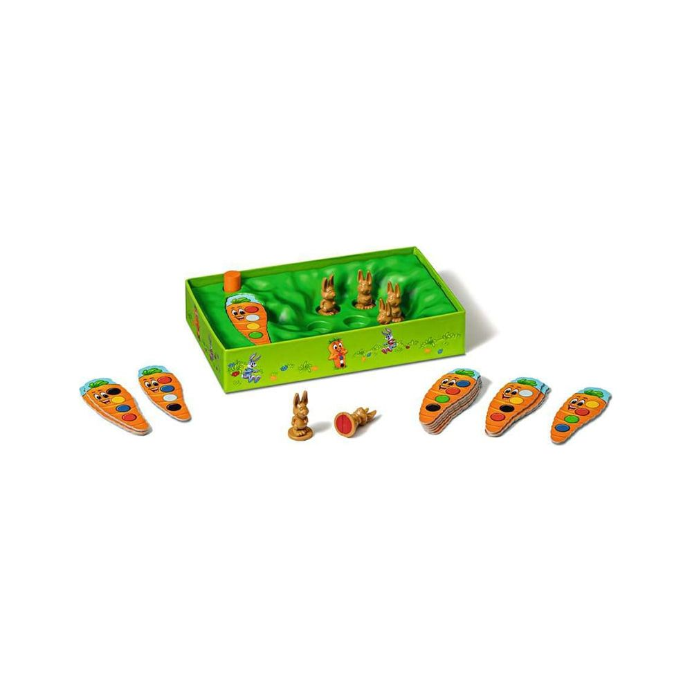 Brettspiel mit Karotten und Hasenfiguren auf grünem Feld.