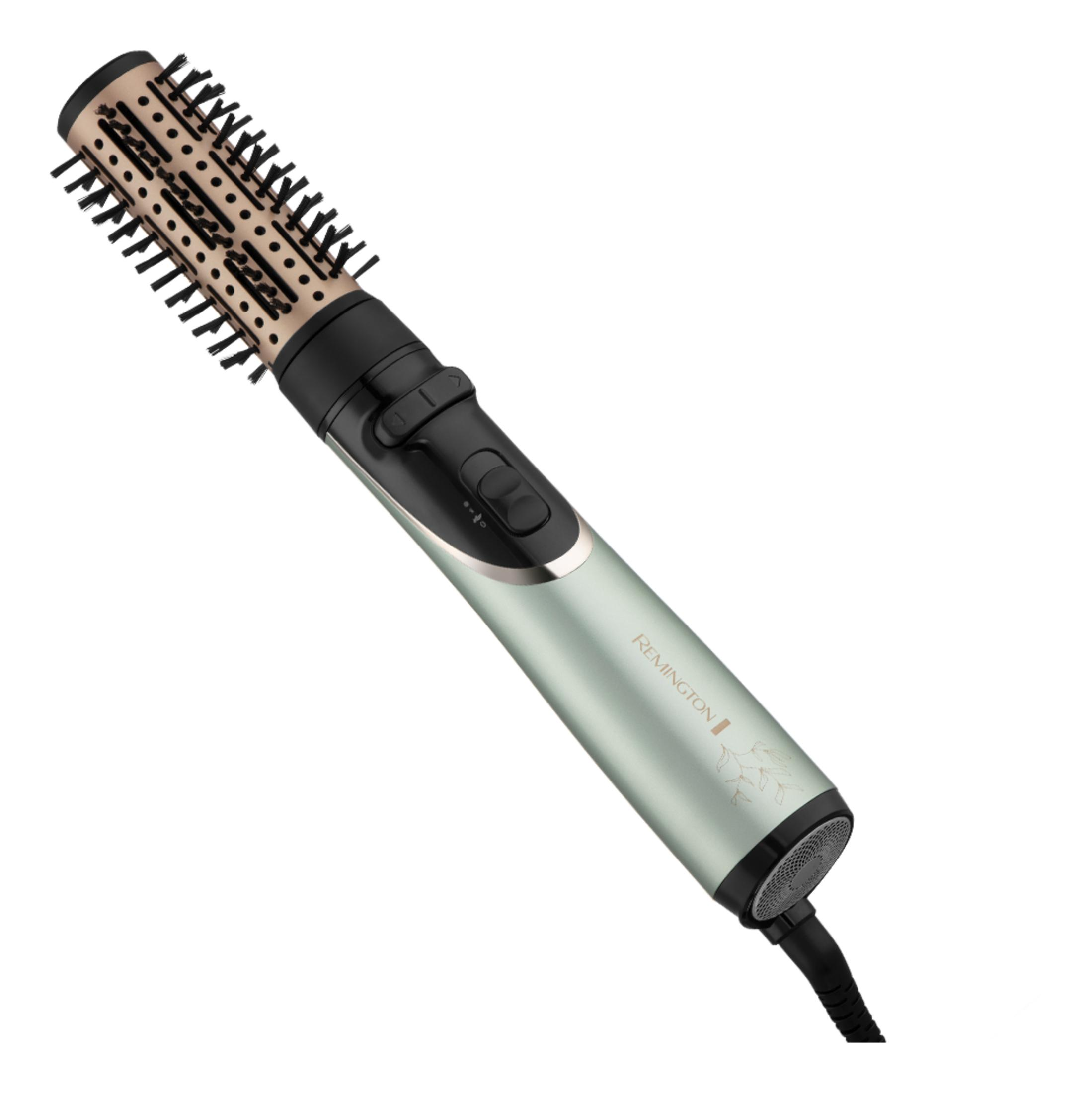 Srebrna suszarka Remington ze złotą głowicą szczotkową i czarnym włosiem.