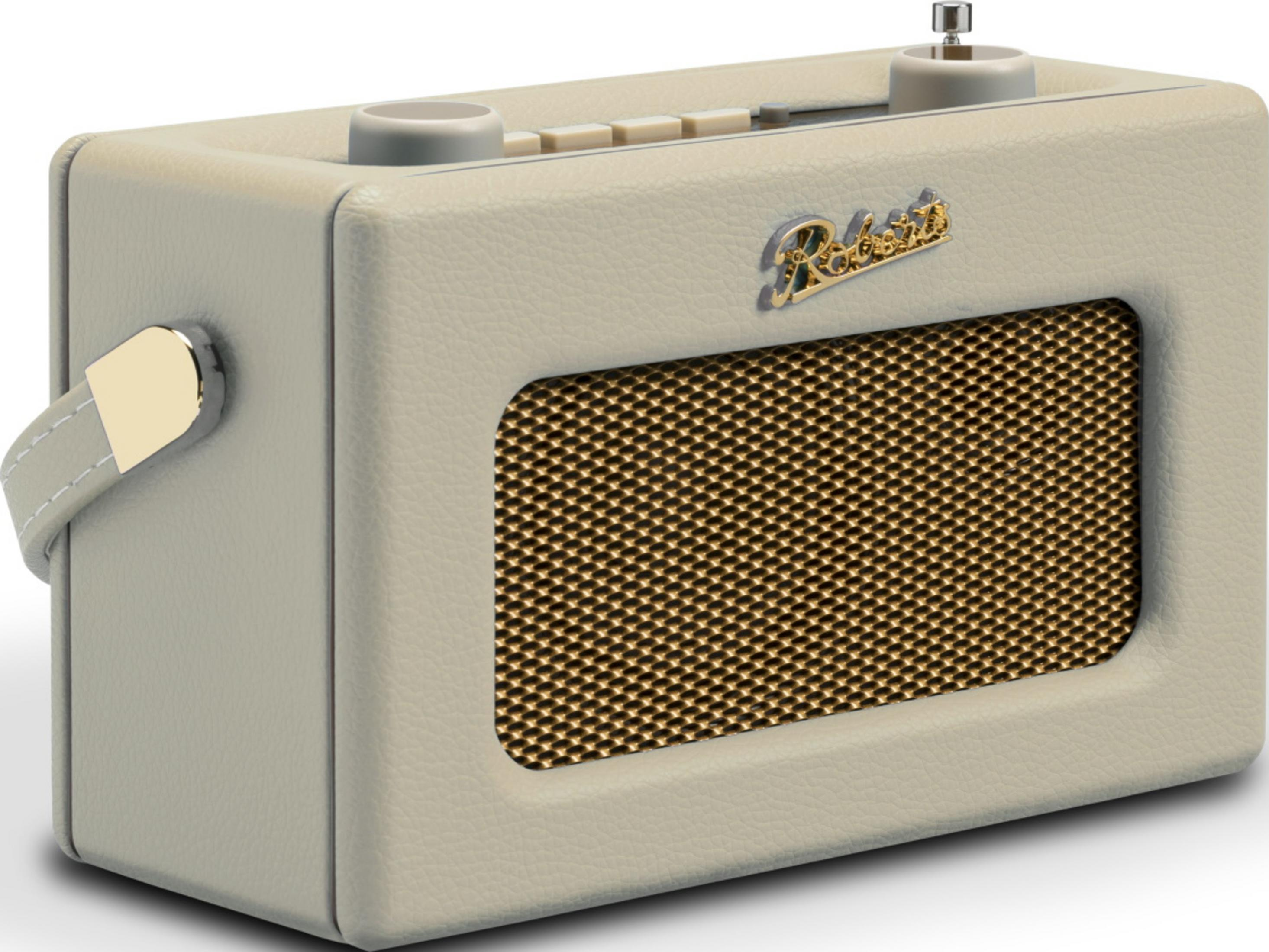 Kremowe radio retro ze złotą kratką głośnika i skórzanym uchwytem.
