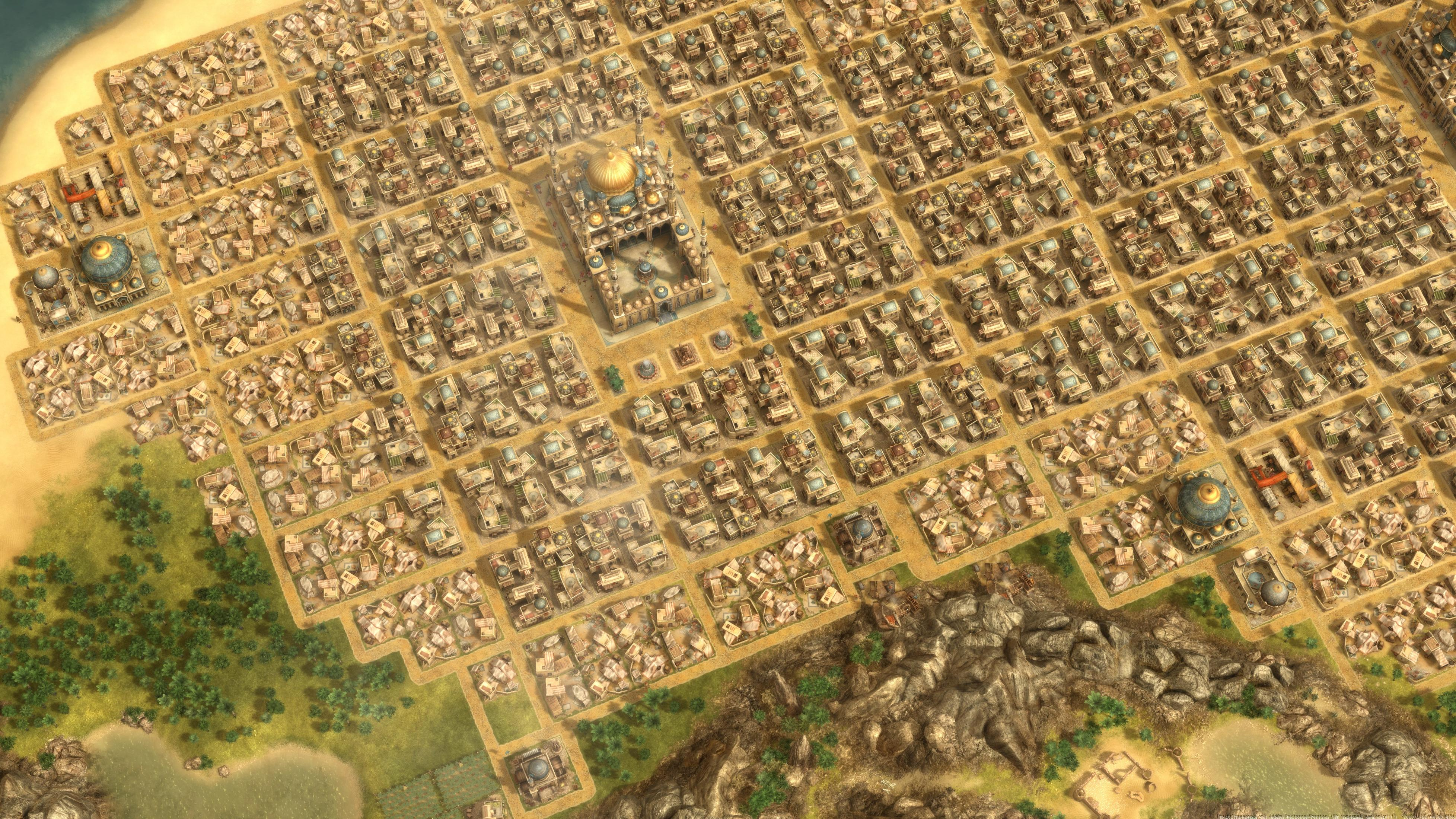 Eine Stadtansicht aus der Vogelperspektive mit vielen kleinen Gebäuden, einem großen goldenen Kuppelgebäude und grünem Gras.
