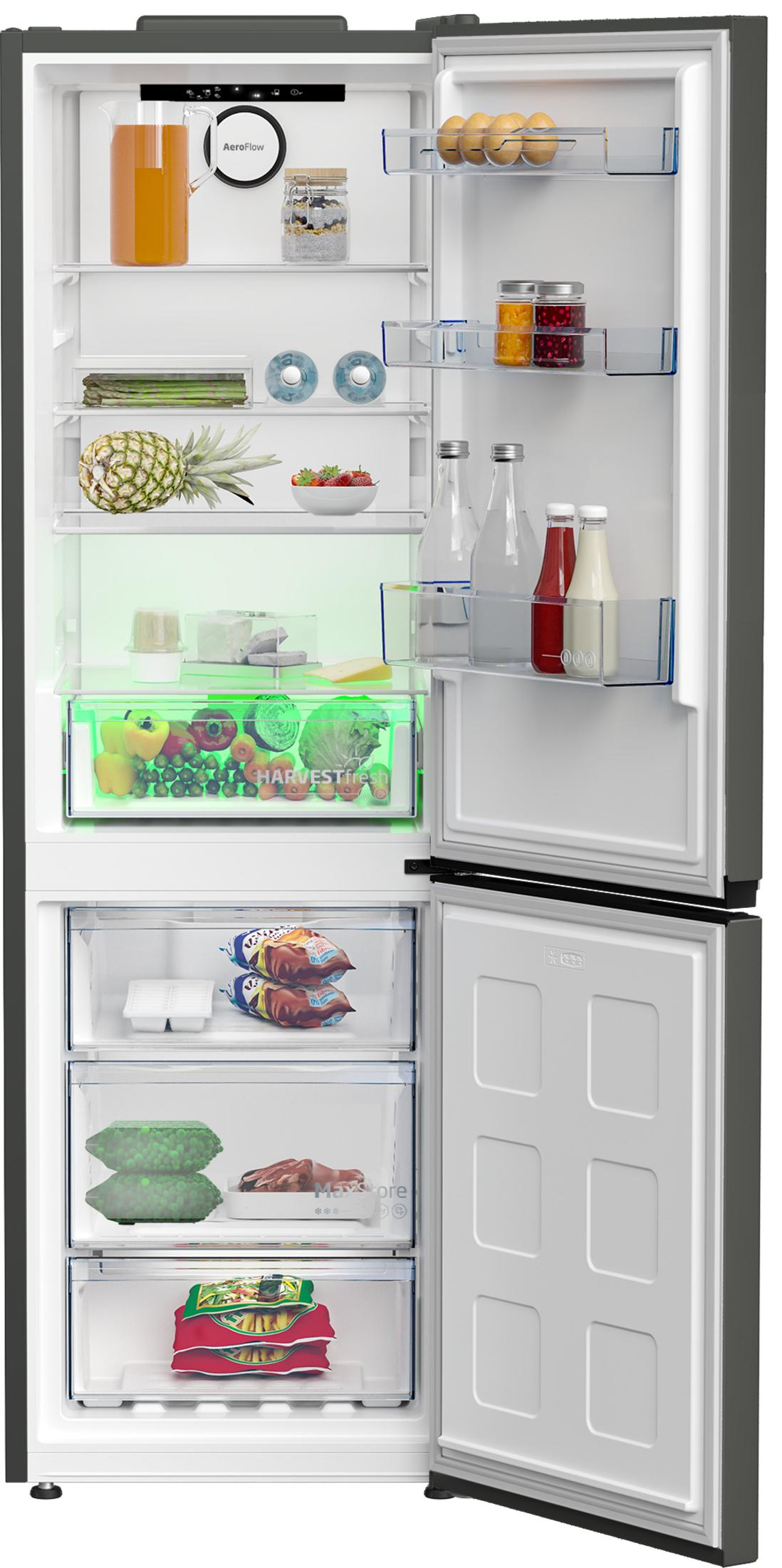 Ein offener Kühlschrank mit Lebensmitteln: Obst, Gemüse, Eier, Flaschen und gefrorene Lebensmittel.