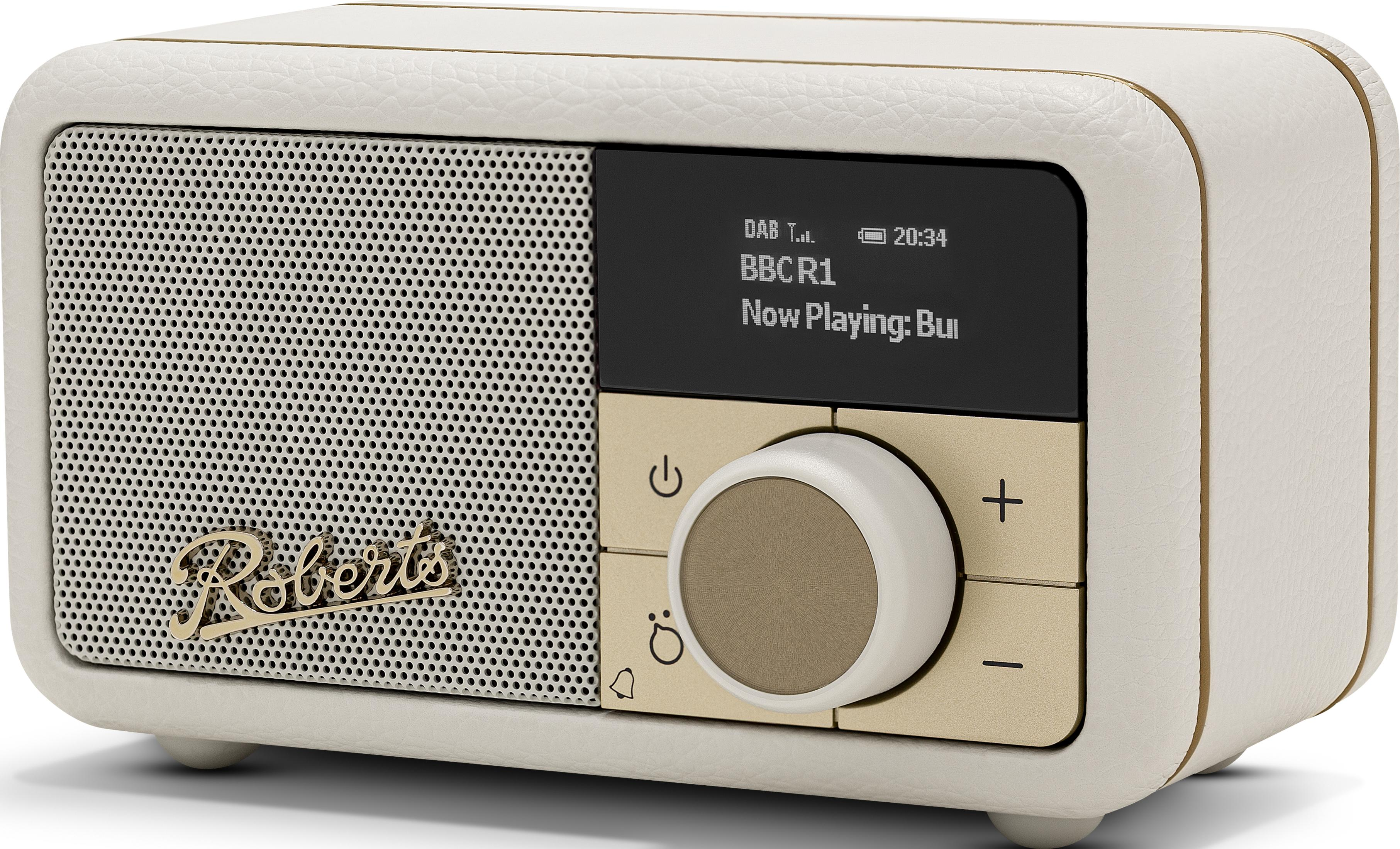 Ein cremefarbener Retro-Radio mit Lautsprecher, Display und Drehregler.