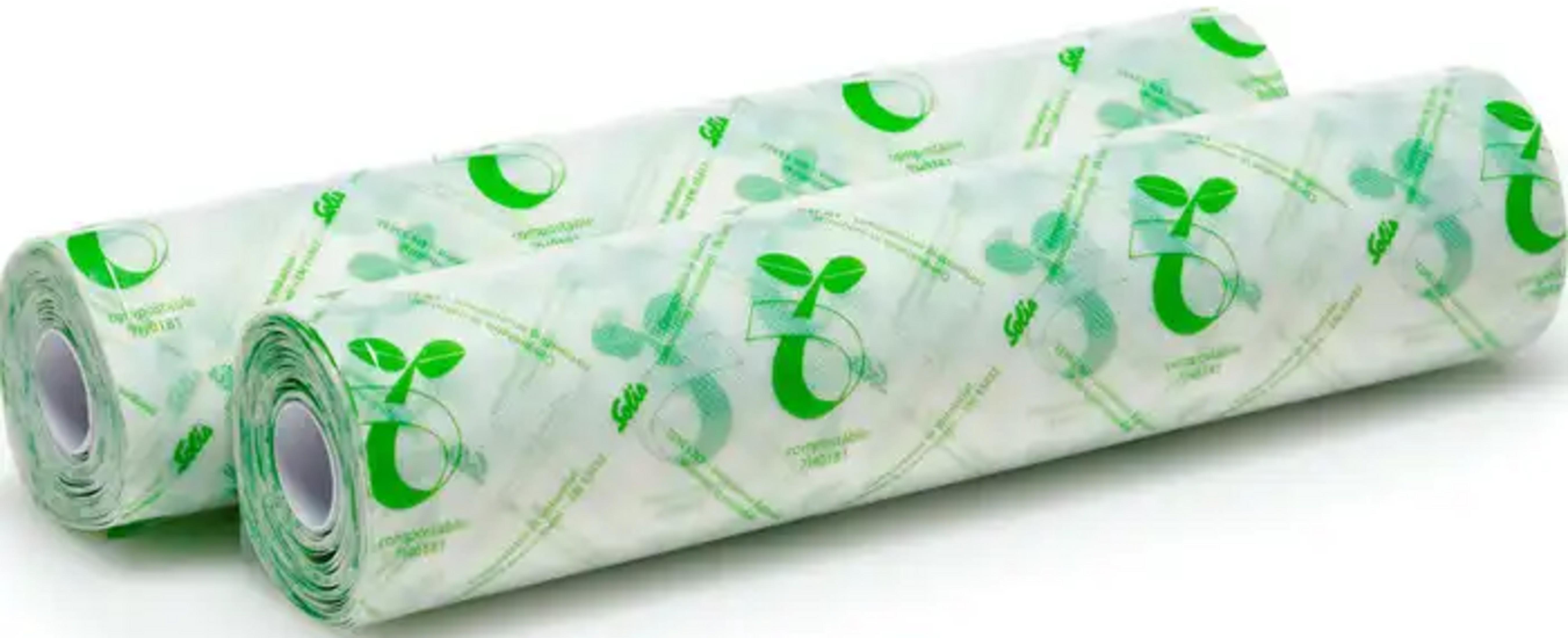 Due rotoli di carta trasparente con motivi vegetali verdi e testo.