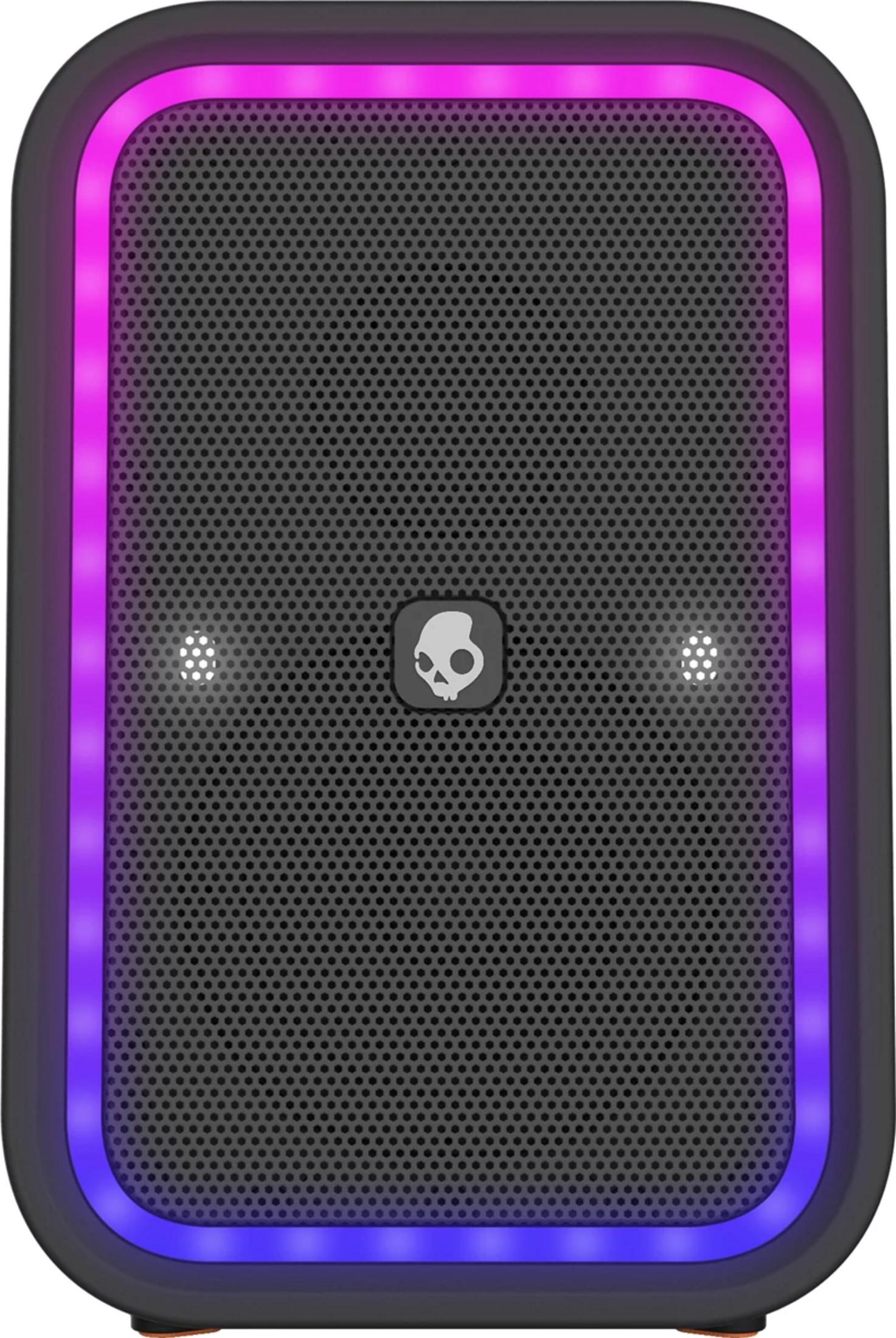 Schwarzer Lautsprecher mit Skullcandy-Logo, beleuchtet mit Pink- und Blautönen.