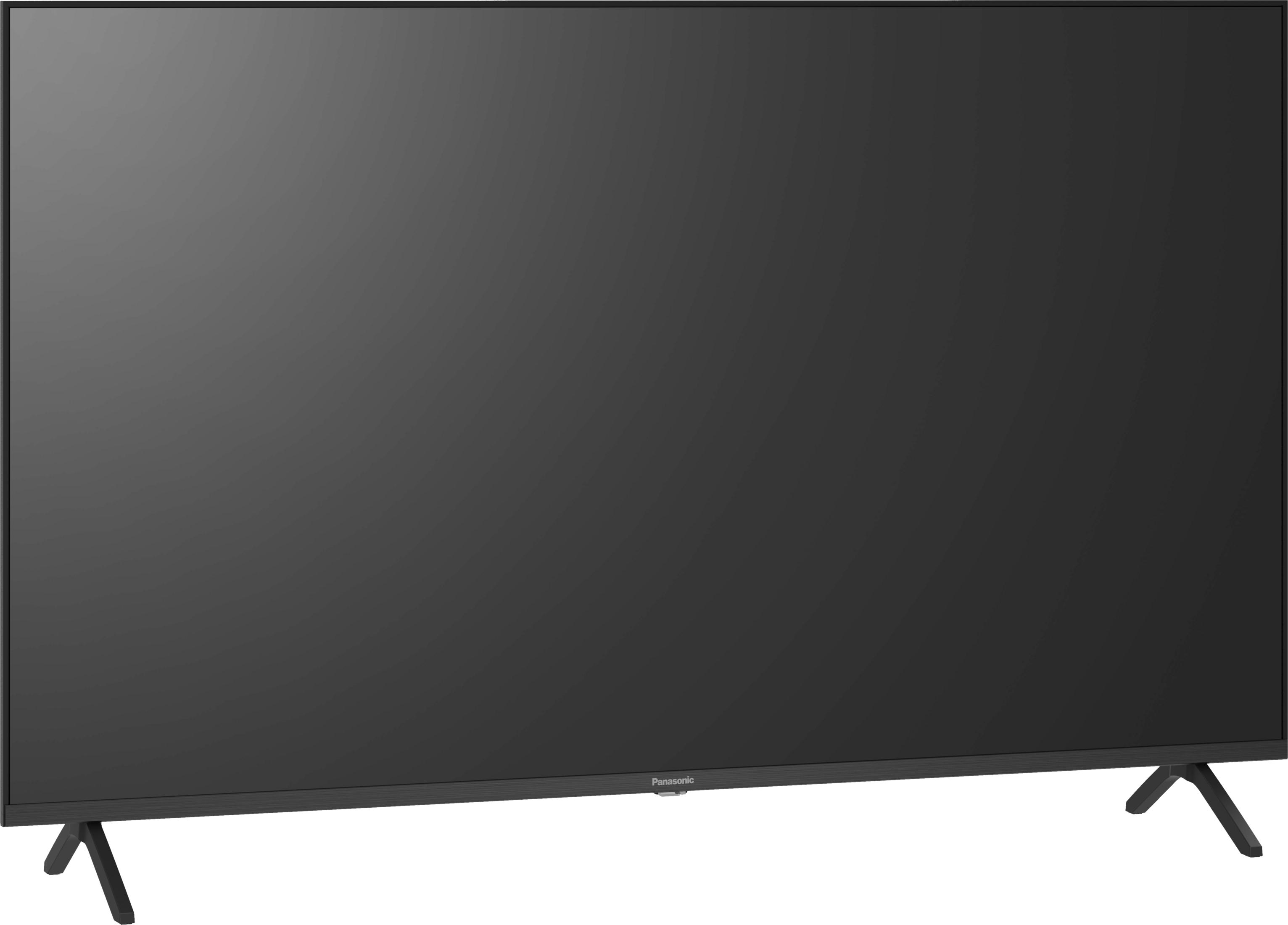 Un téléviseur noir Panasonic est posé sur fond blanc avec deux pieds en forme de V.