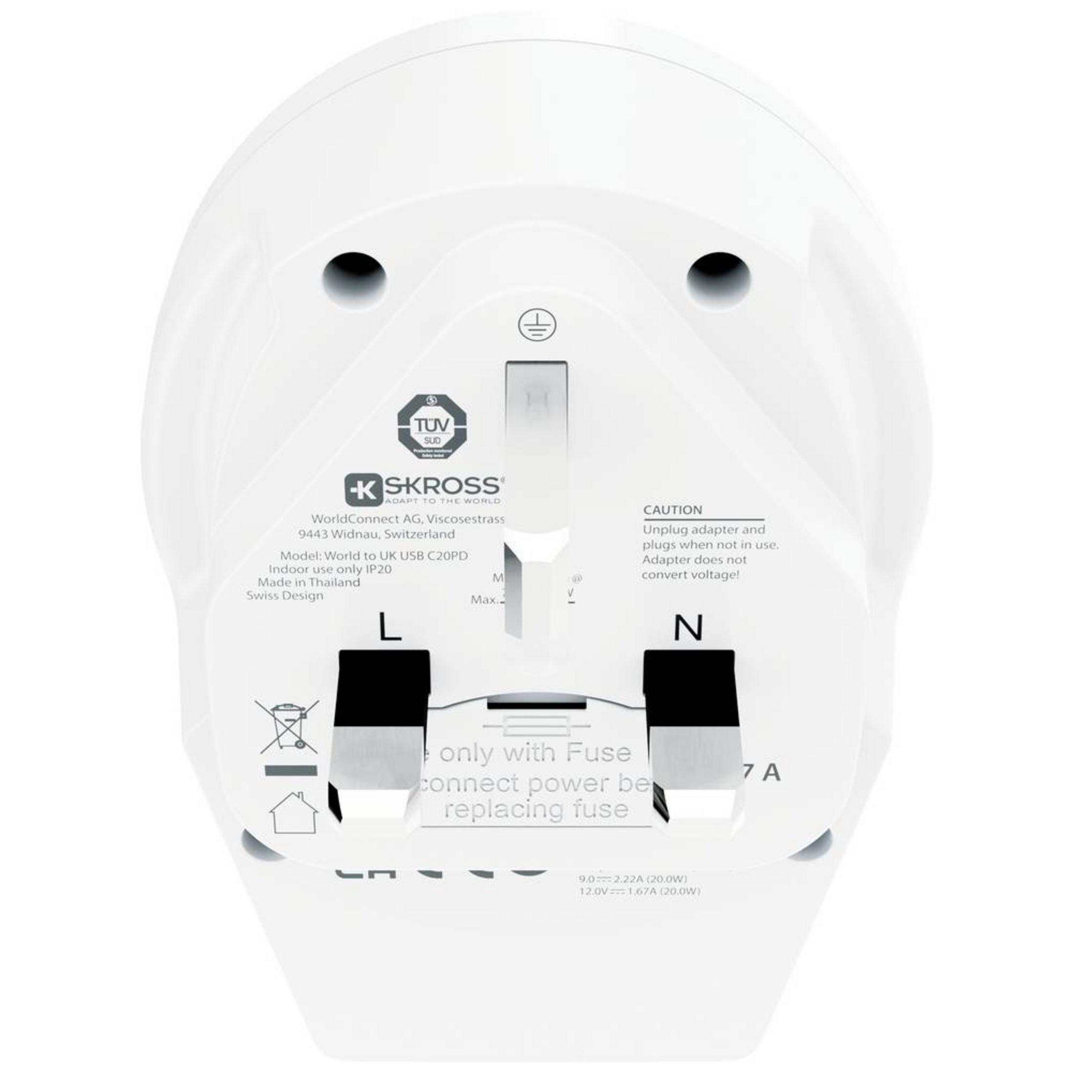 Adaptador de viaje blanco con conectores L y N, texto de precaución y especificaciones.