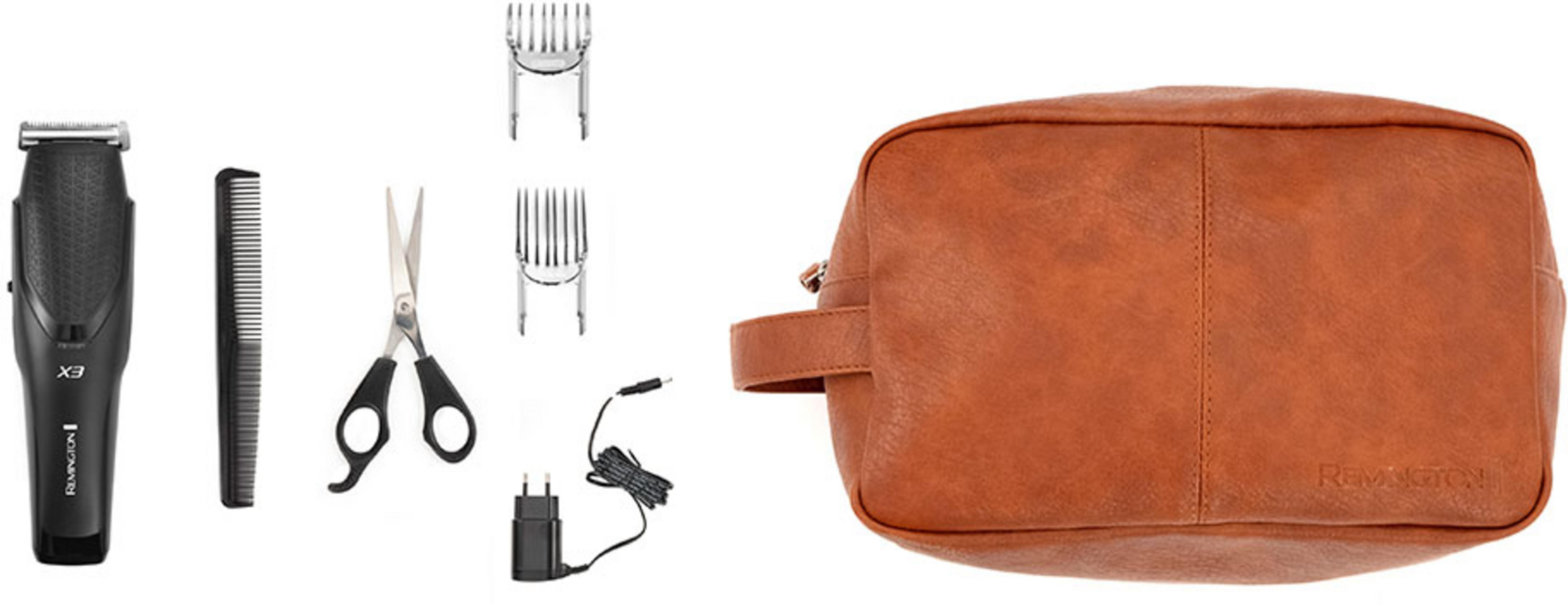 Ein schwarzer Haartrimmer, Kamm, Schere, Aufsätze, Ladegerät und eine braune Tasche.