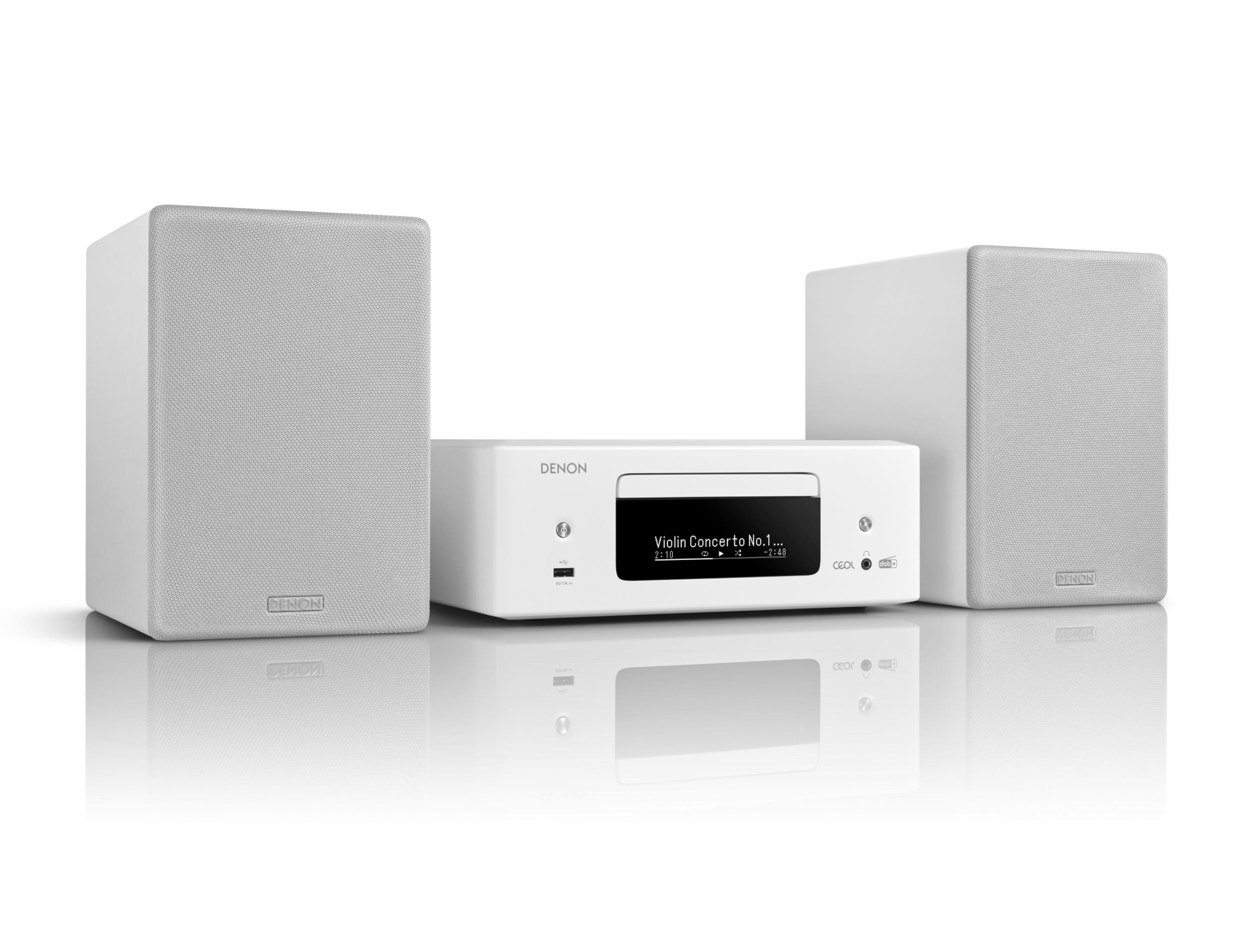 Impianto stereo Denon bianco con due altoparlanti e un lettore CD centrale.