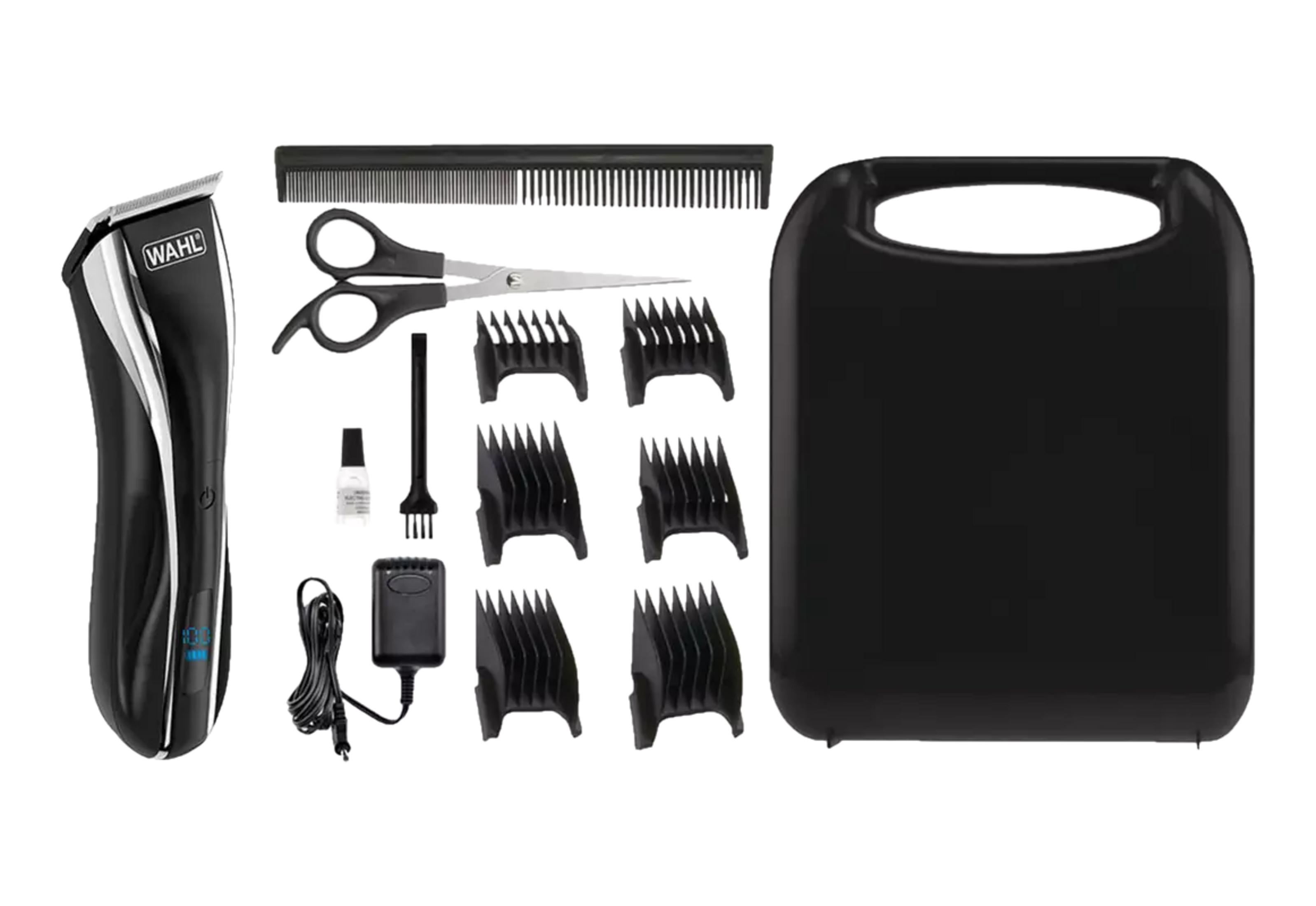 Un set di tagliacapelli con accessori: tagliacapelli, pettini, forbici, olio, spazzola, caricabatterie e custodia.
