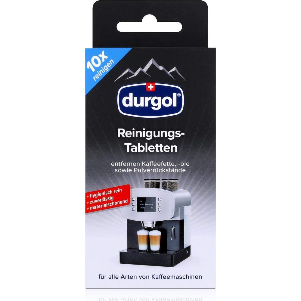 Durgol Reinigungs-Tabletten Packung mit Kaffeemaschine und zwei Tassen Kaffee.