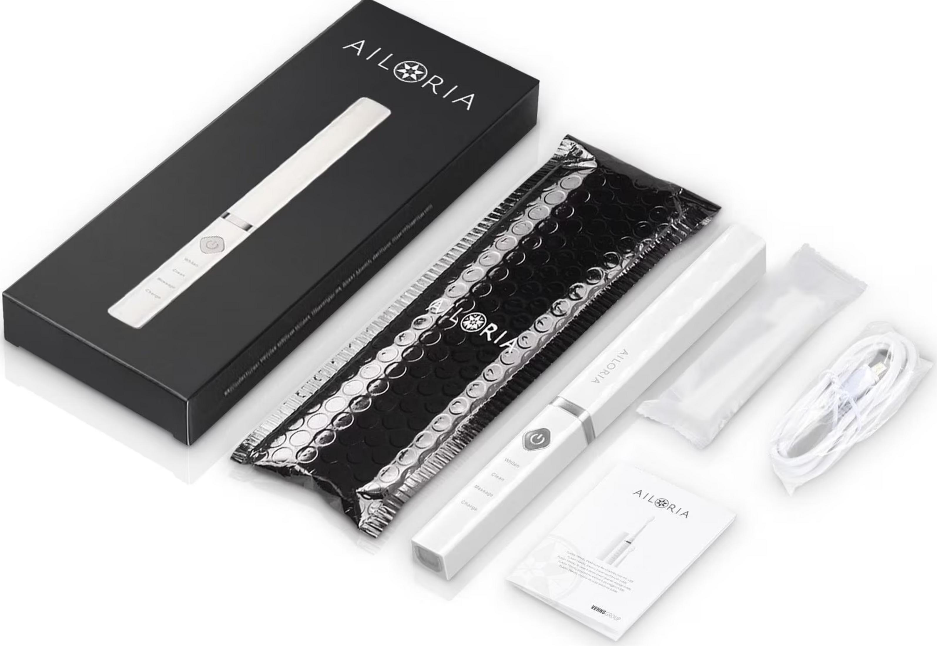 AILORIA-Zahnbürste mit Ladebox, Kabel und Anleitung auf weißem Hintergrund.