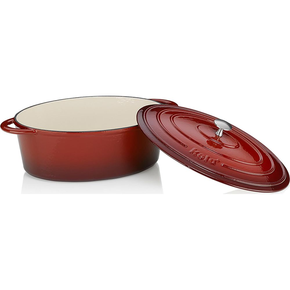 Roter ovaler Gusseisentopf mit cremefarbener Innenseite und abgenommenem Deckel.