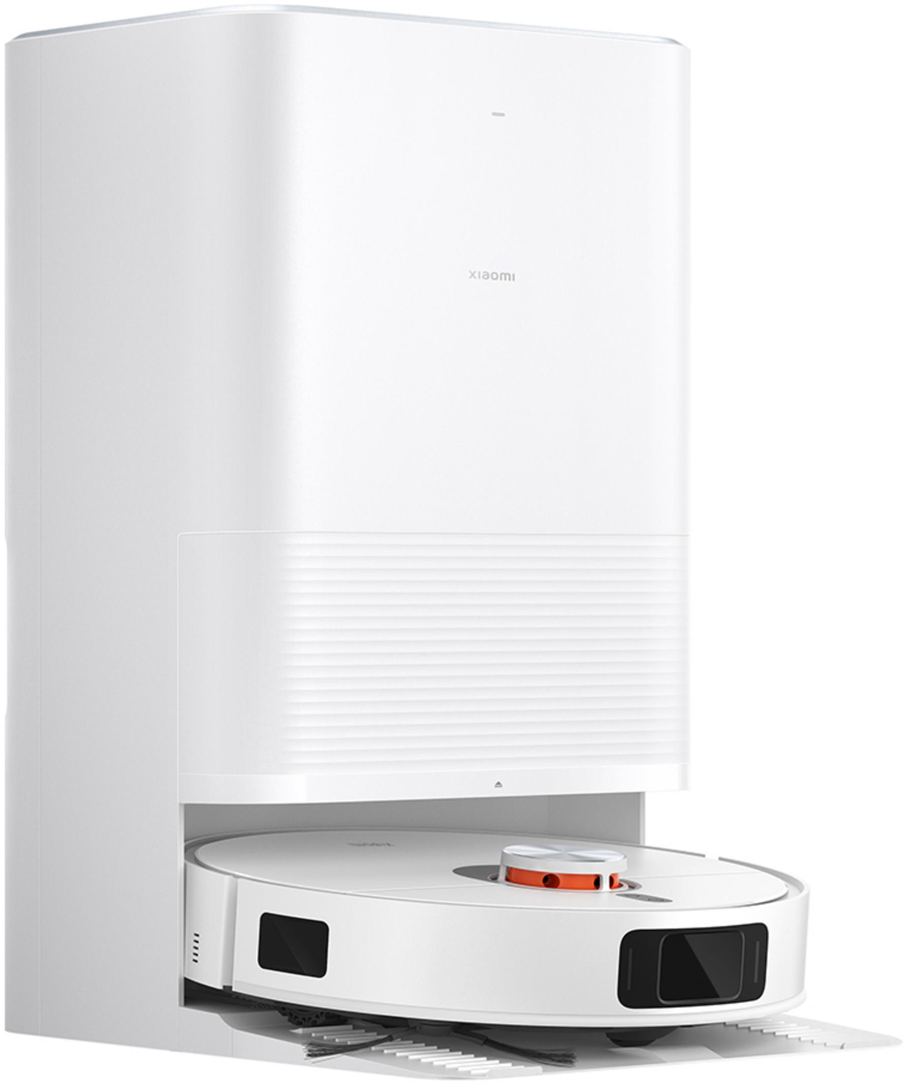 Biały robot sprzątający ze stacją ładującą i pomarańczowymi akcentami.