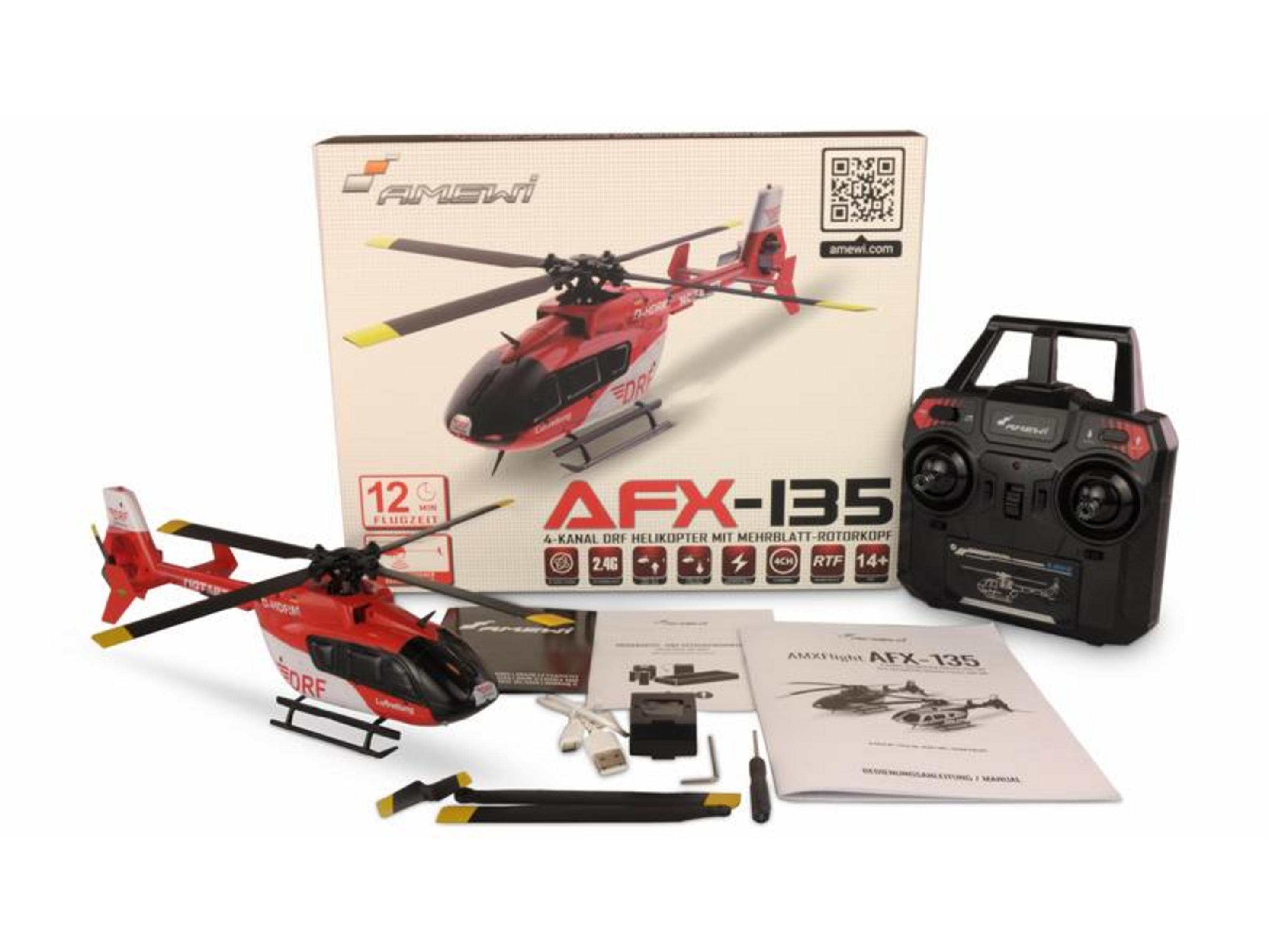 Un helicóptero de juguete rojo y blanco con mando a distancia y accesorios.