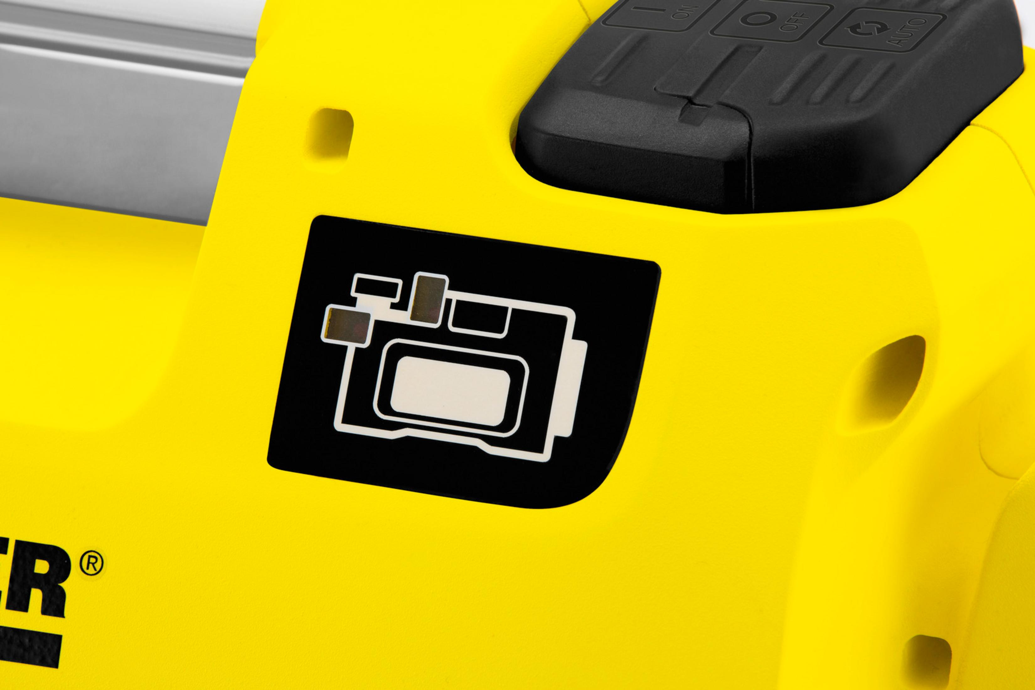 Un dispositivo amarillo con símbolo y controles negros.
