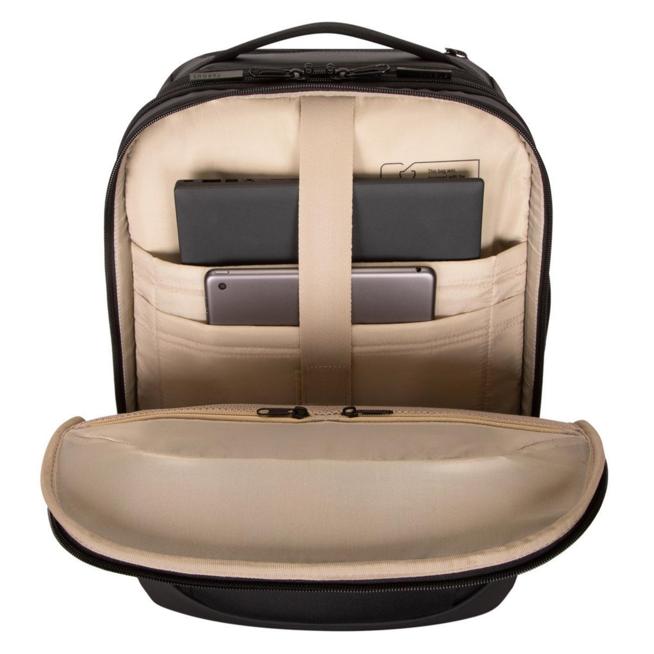 Mochila negra abierta con interior claro. Se ven dos tabletas dentro.