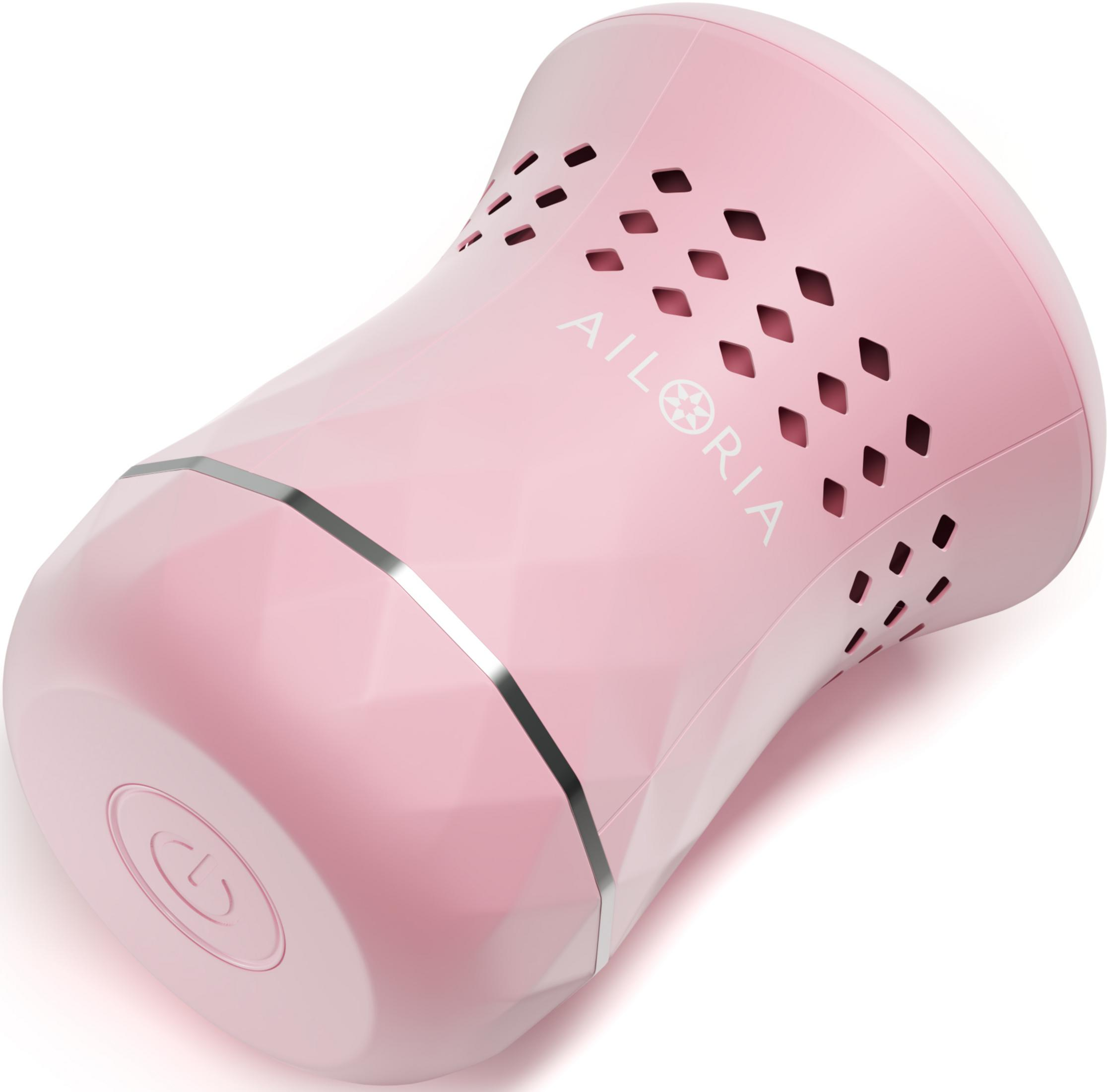 Un appareil de soin rose, forme diamant, avec trous de ventilation et logo.