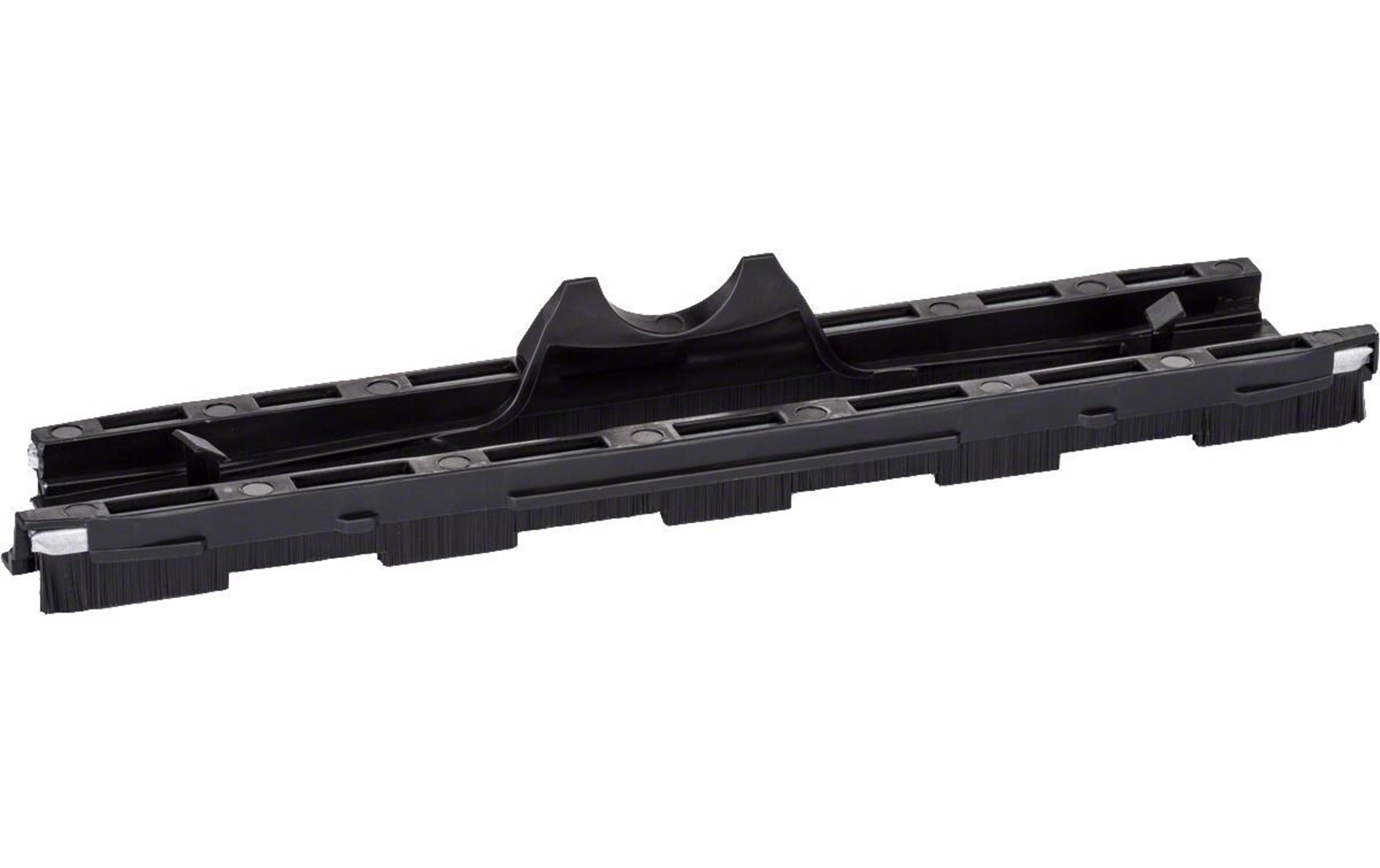 Czarny przyrząd do kopiowania kształtów z szczotkami na dole.