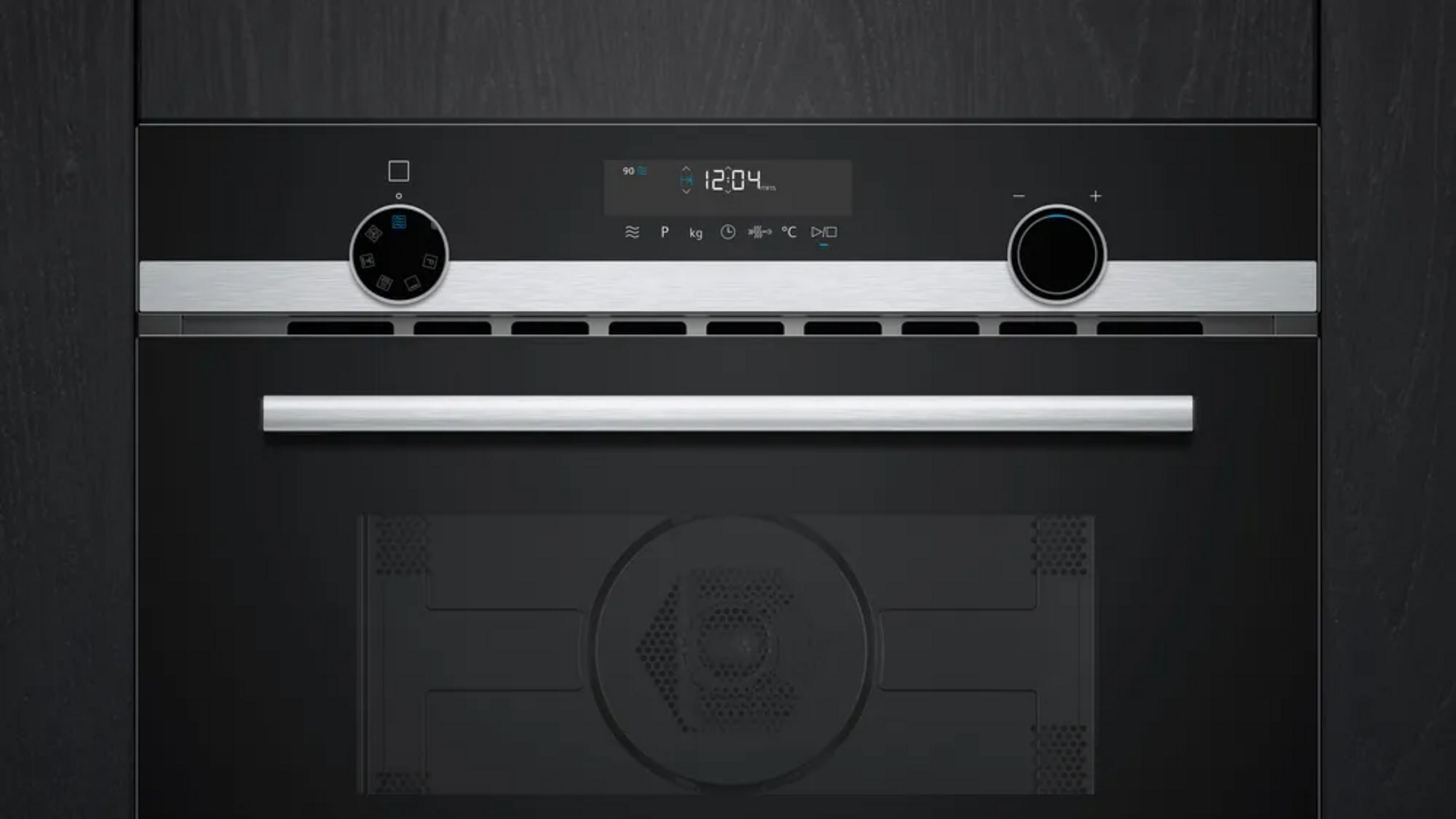 Modern black oven with touchscreen and dials. Displays 12:04.