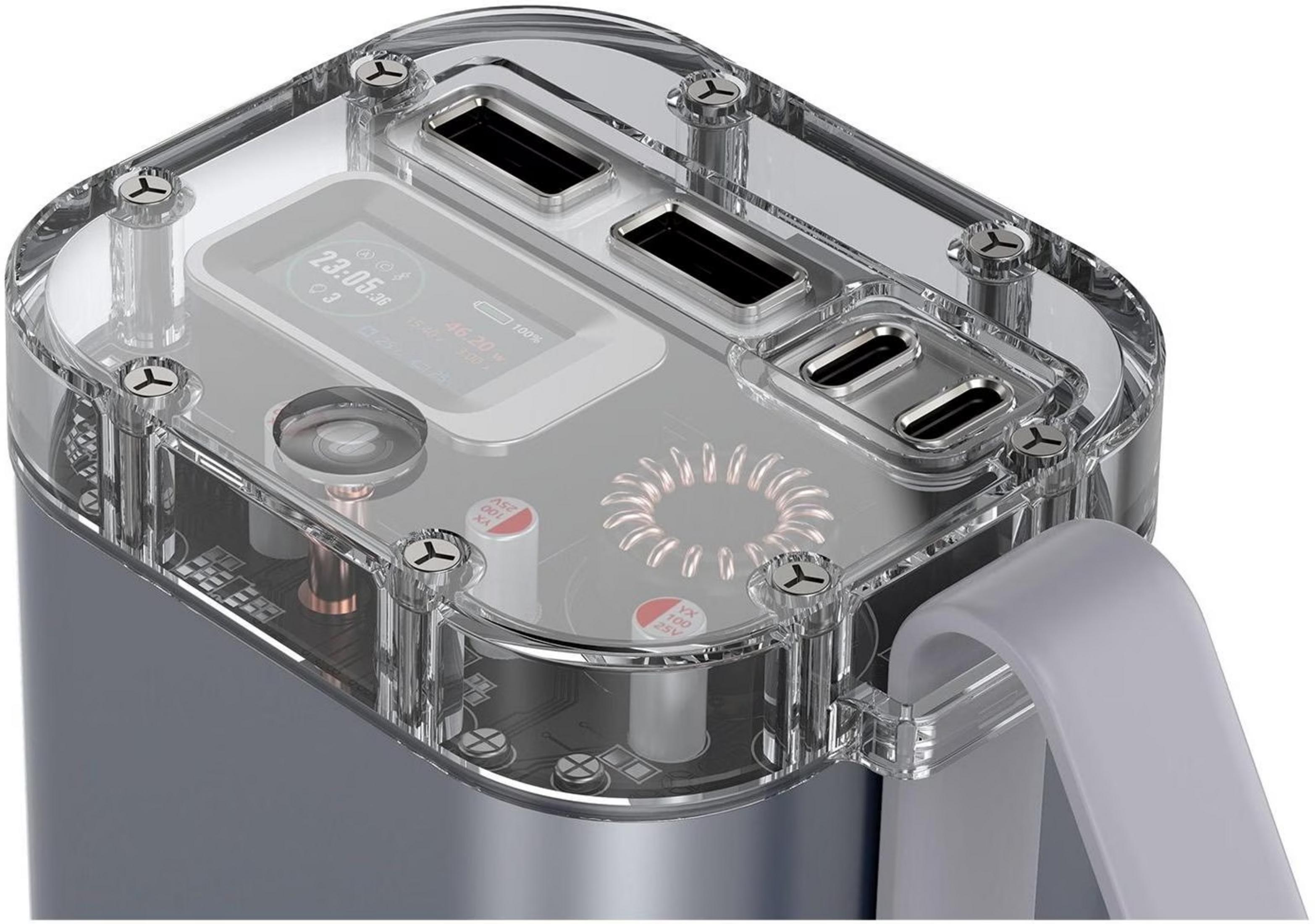 Batterie externe transparente avec écran numérique, ports USB et composants internes visibles.