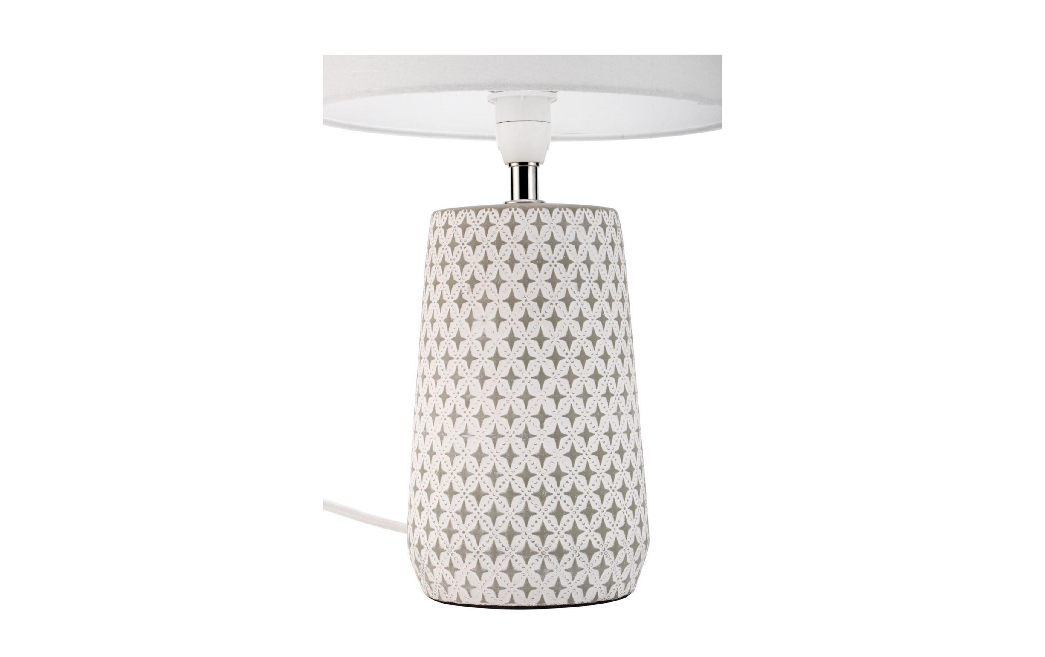 Szara lampa z białym abażurem i wzorem gwiazd na białym tle.
