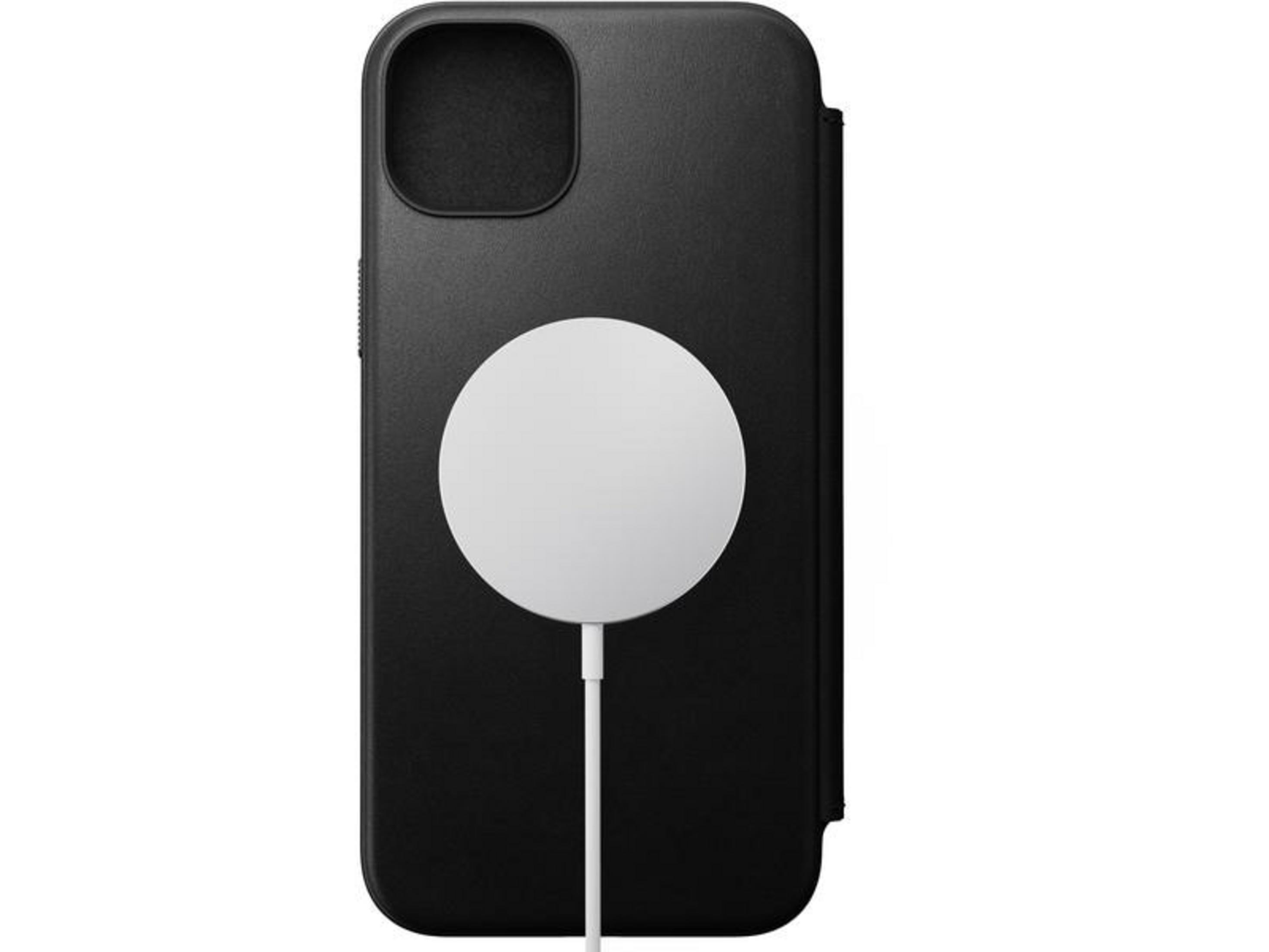Custodia nera per iPhone con caricabatterie e cavo MagSafe bianchi.