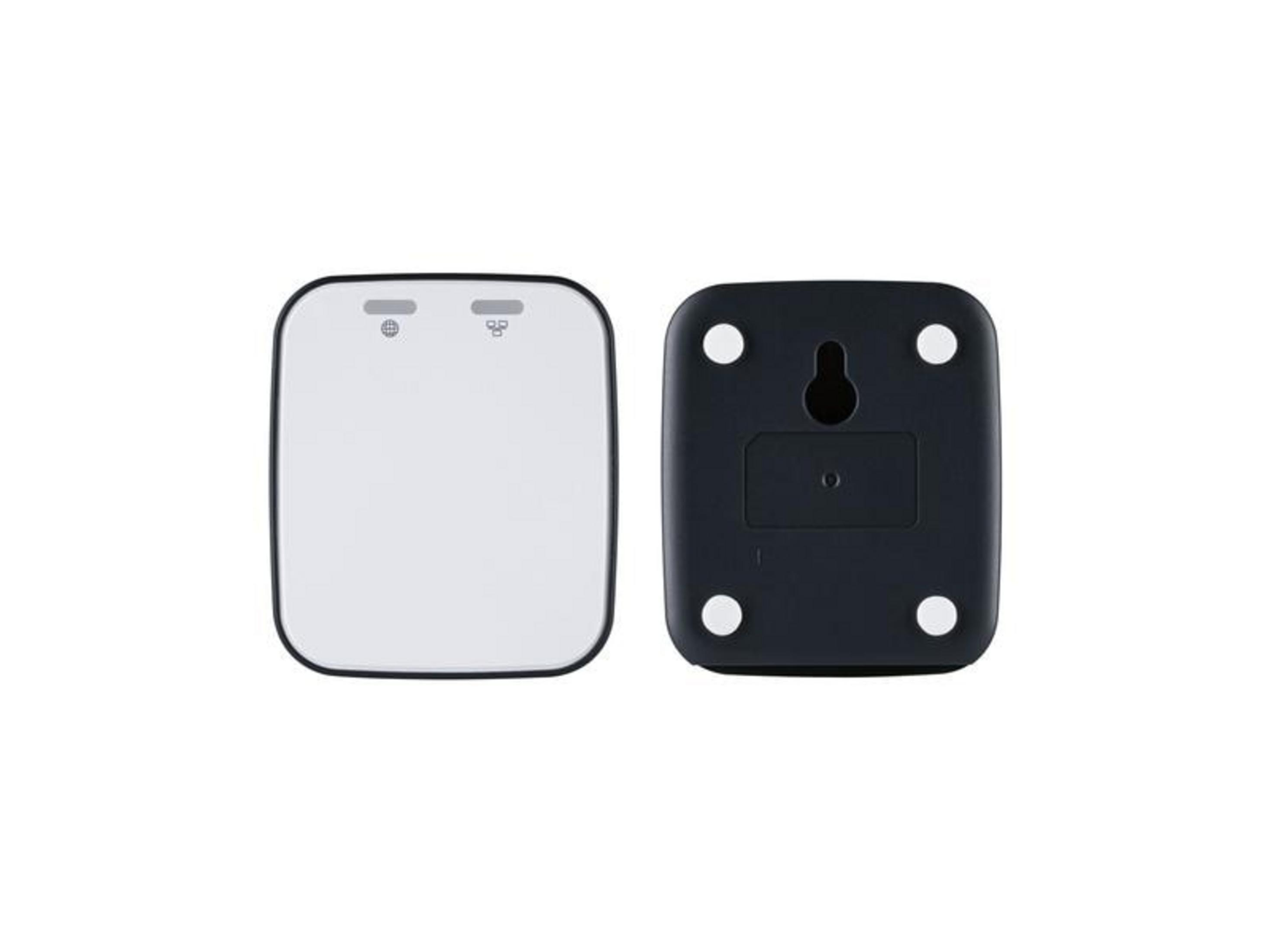 Białe i czarne urządzenia obok siebie, białe z symbolami, czarne z uchwytem ściennym.