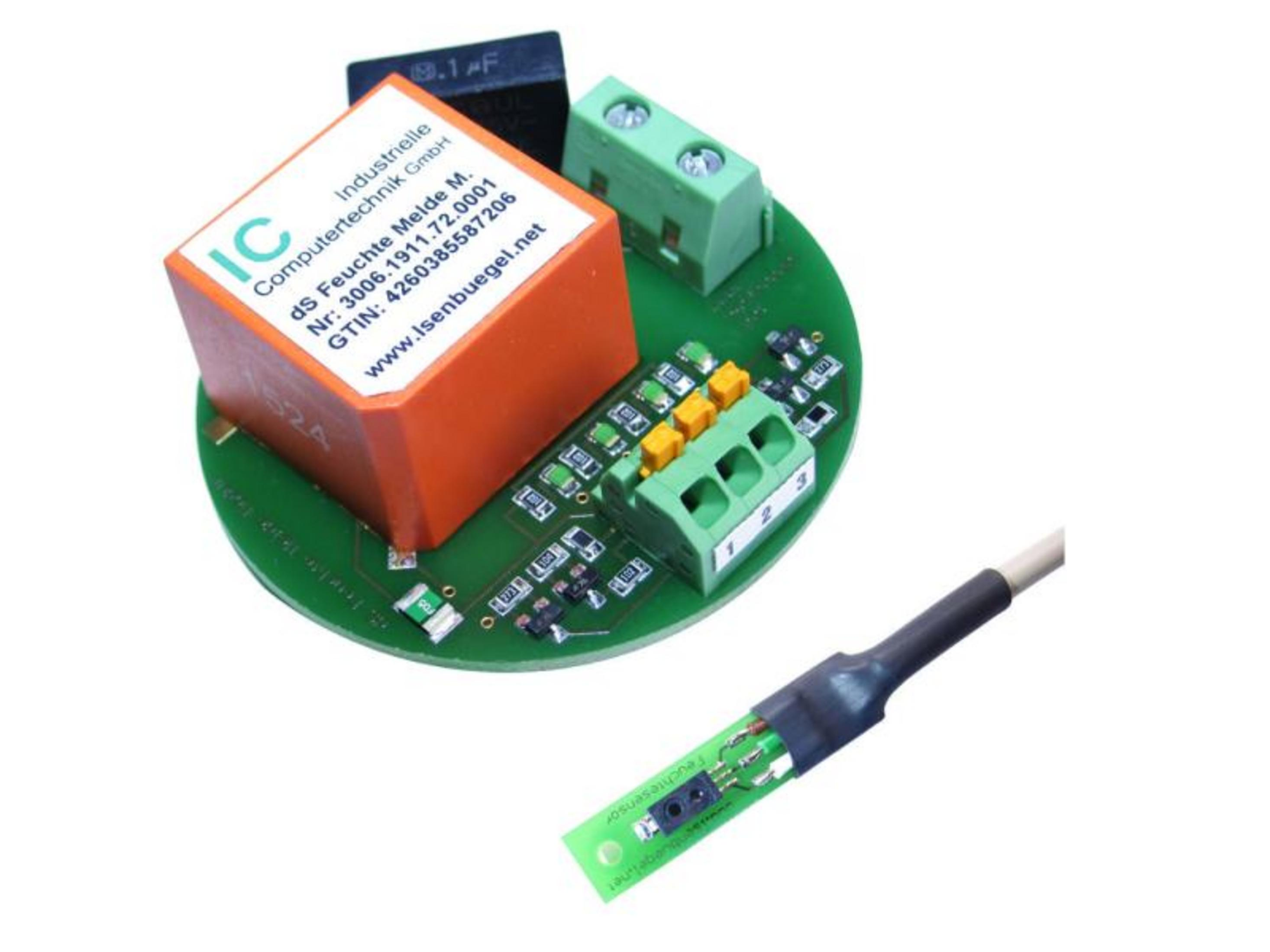 Ein Sensor auf einer Platine mit orangefarbenem Gehäuse und Kabel.
