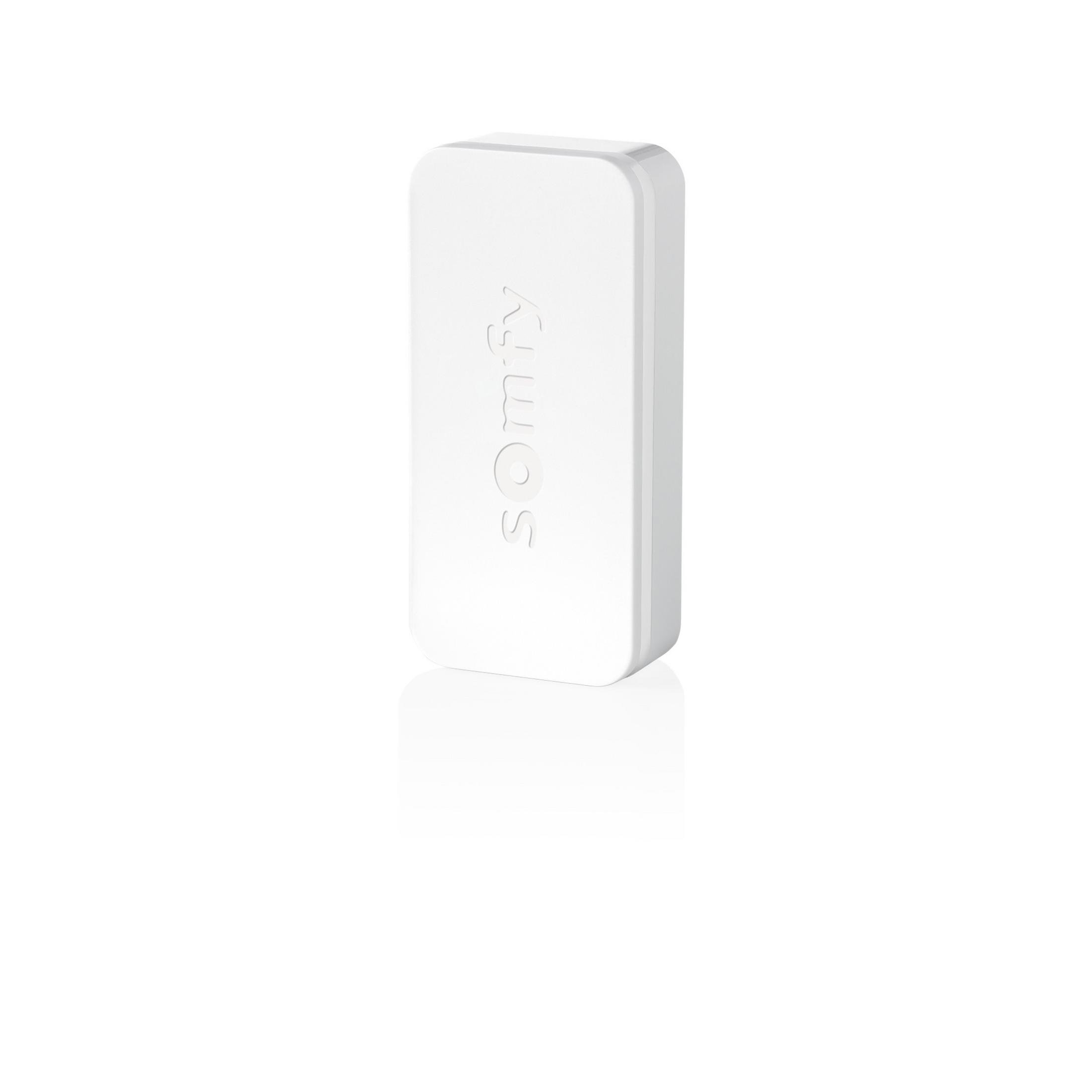 Un dispositivo rettangolare bianco con angoli arrotondati, inciso Somfy.