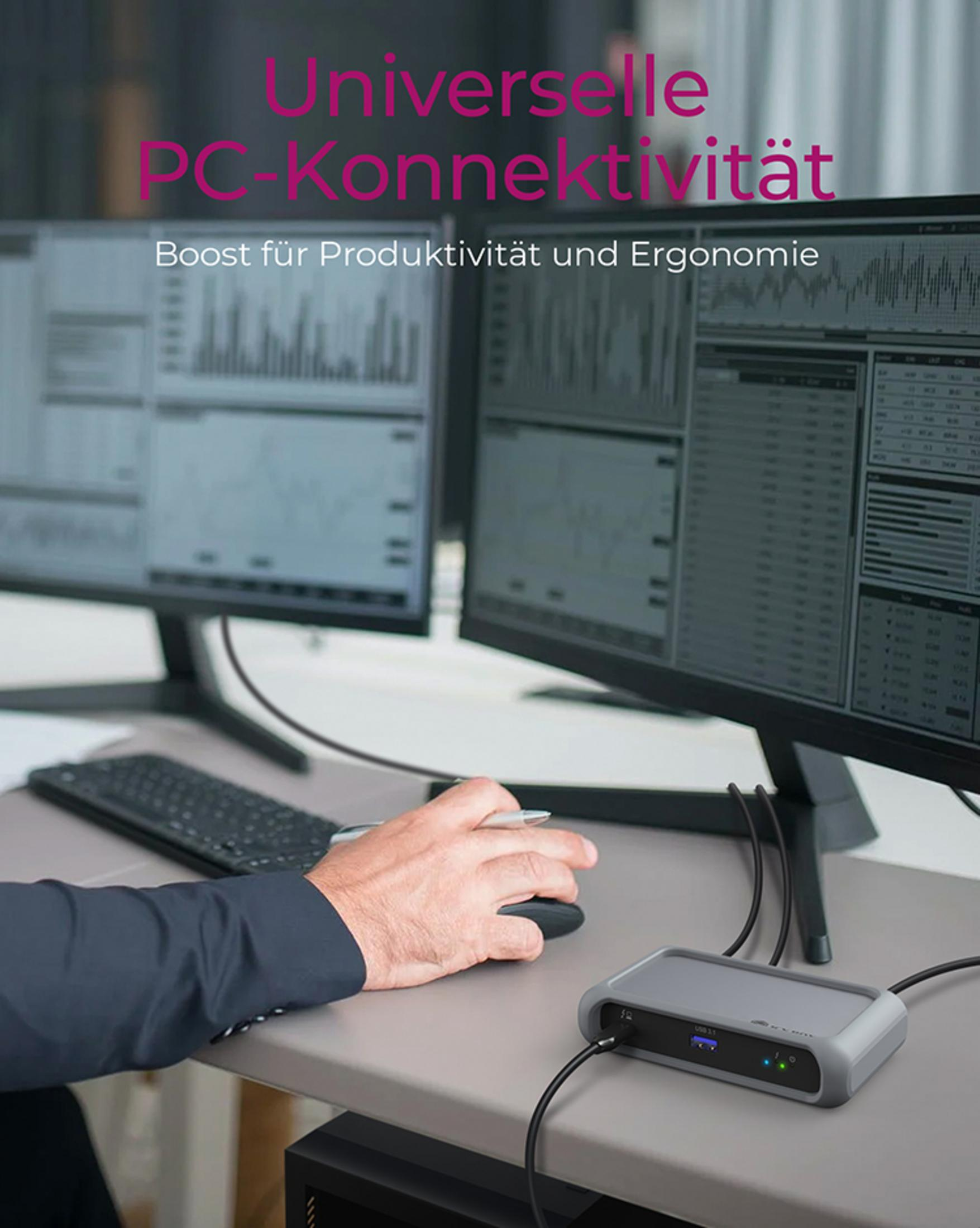 Ein Mann nutzt eine Dockingstation mit zwei Monitoren, die Diagramme anzeigen.