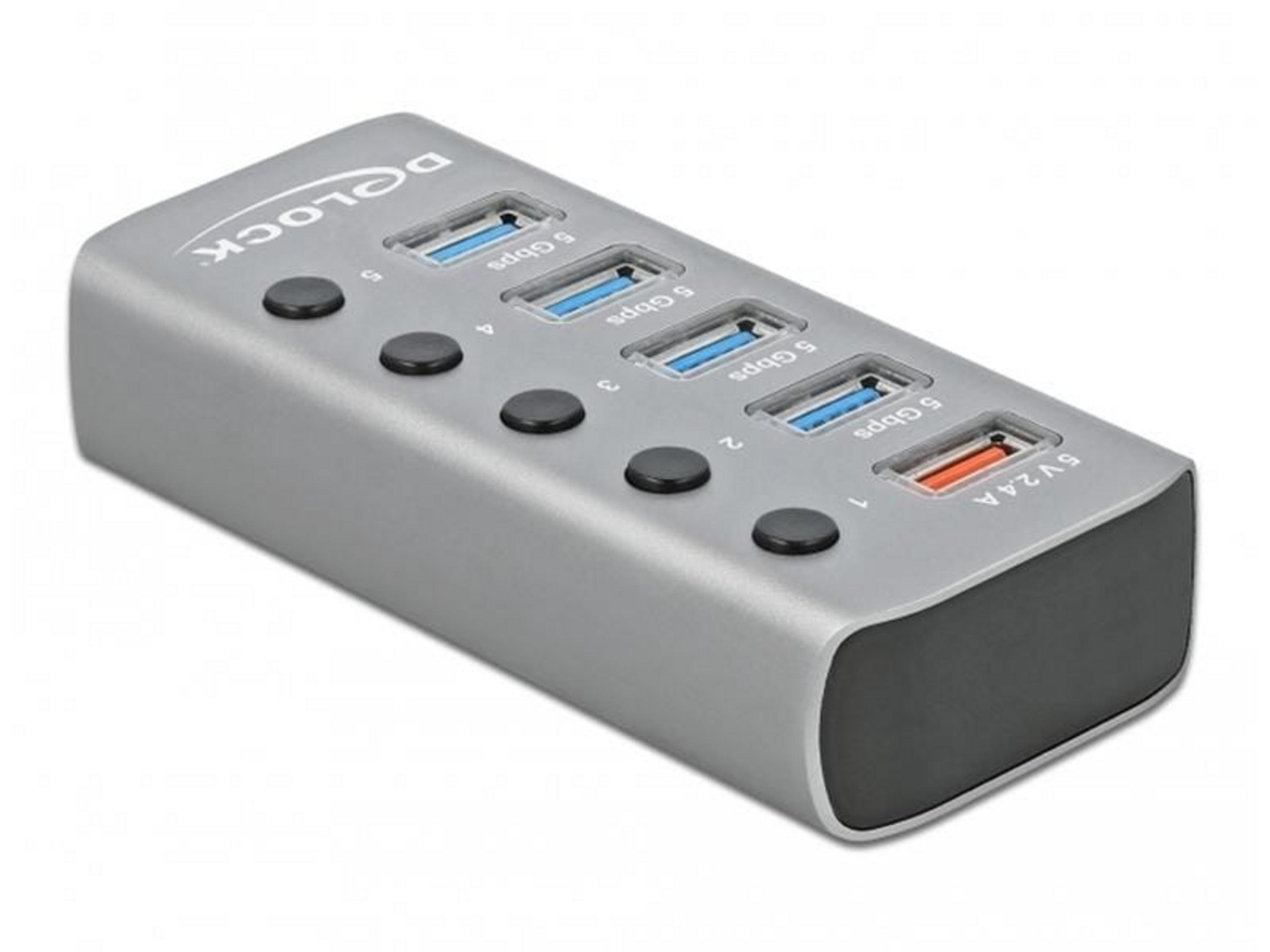 Hub USB gris avec quatre ports 5 Gbps et un port 5V 2.4A.