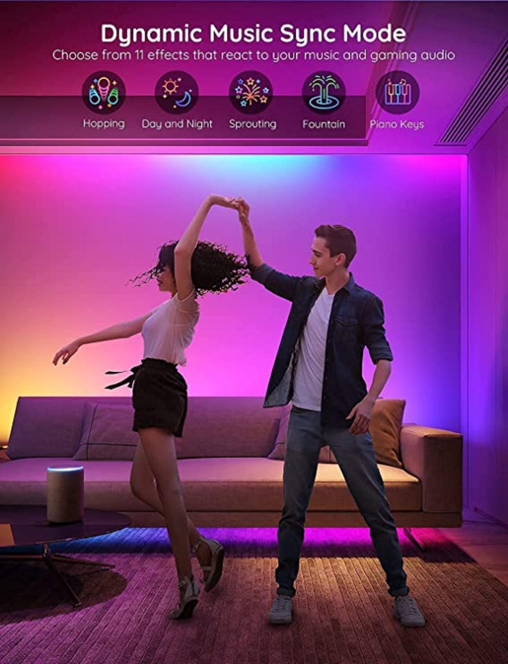 Un couple danse sous des lumières LED dynamiques synchronisées avec la musique et le jeu.