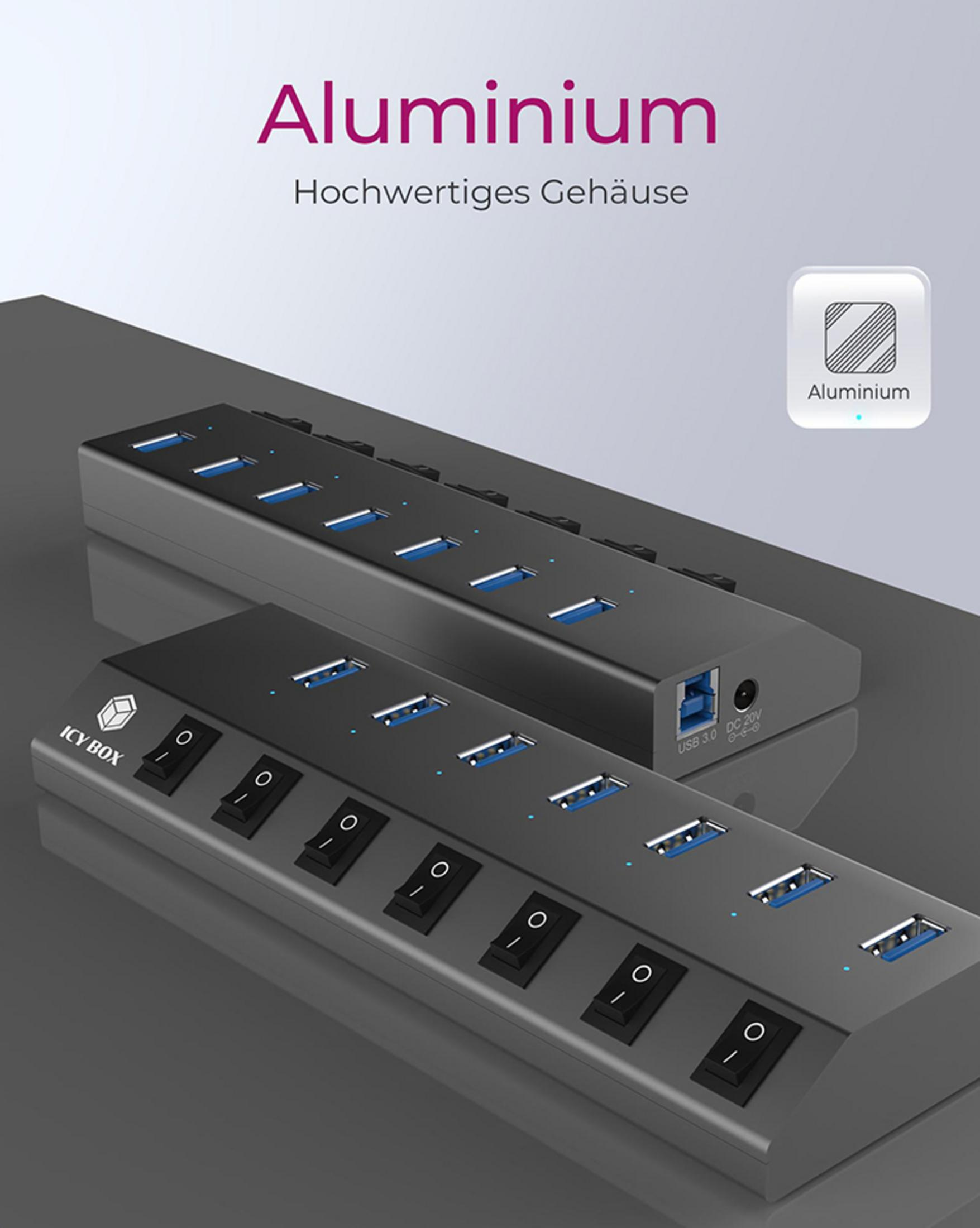 Due hub USB neri con interruttori e porte blu su una superficie grigia.