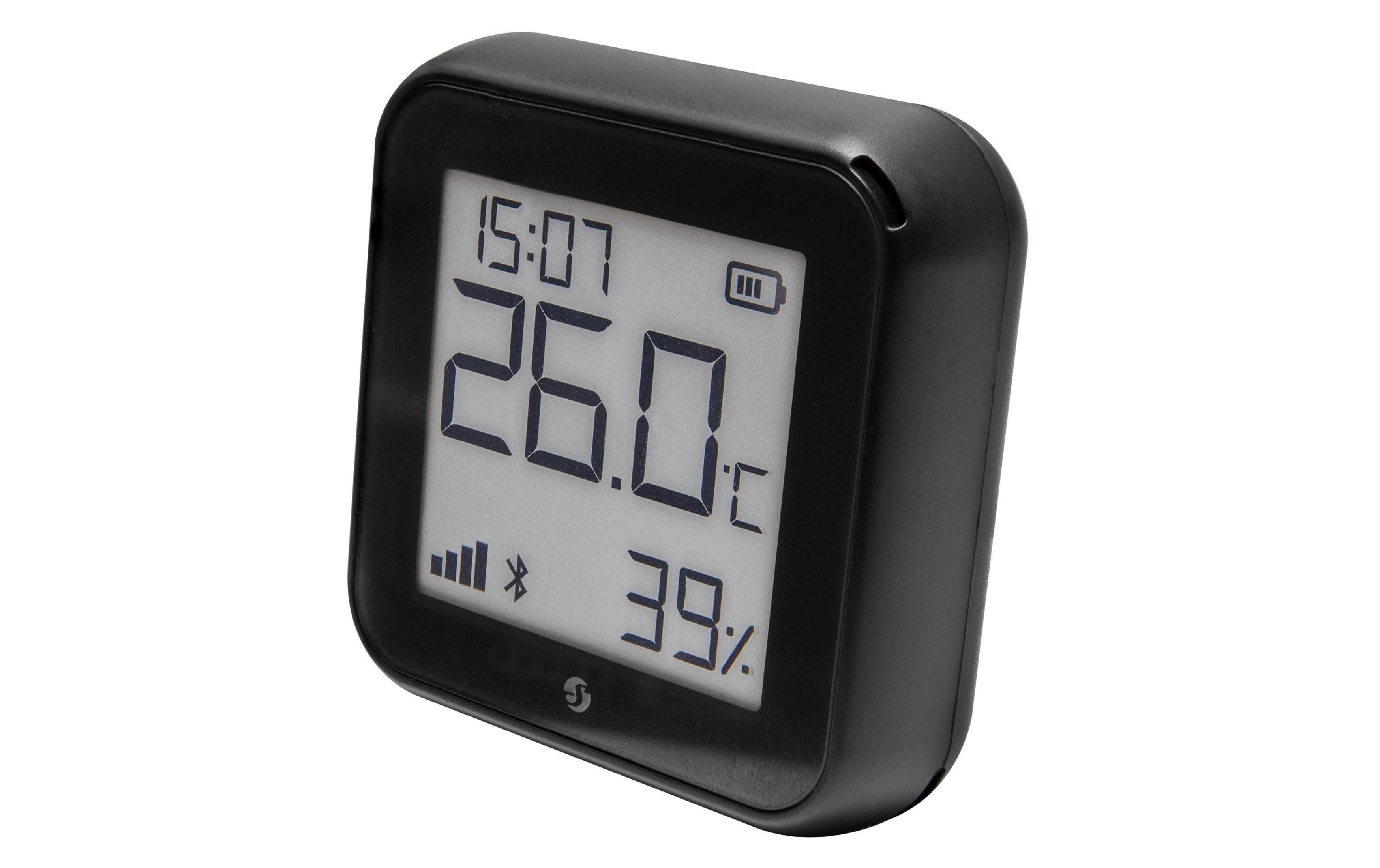 Czarny termometr cyfrowy pokazuje 26 stopni Celsjusza, 39% wilgotności i godzinę 15:07.