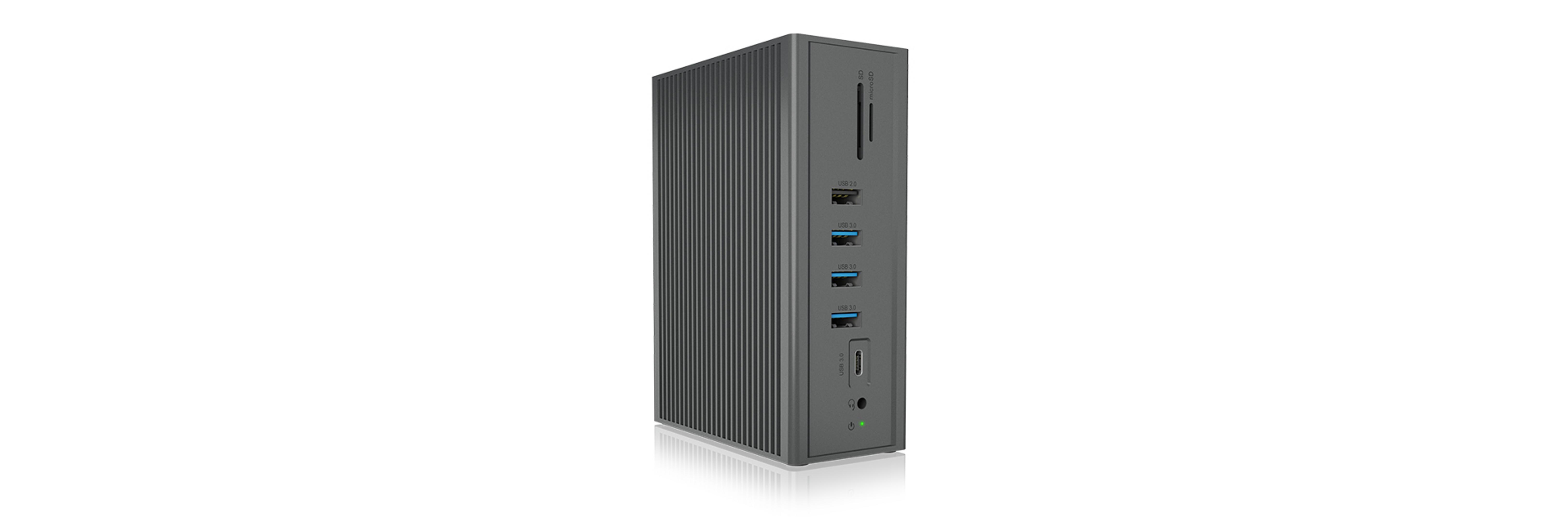 Graues Gerät mit seitlichen Schlitzen, USB-Ports und SD-Kartenleser.