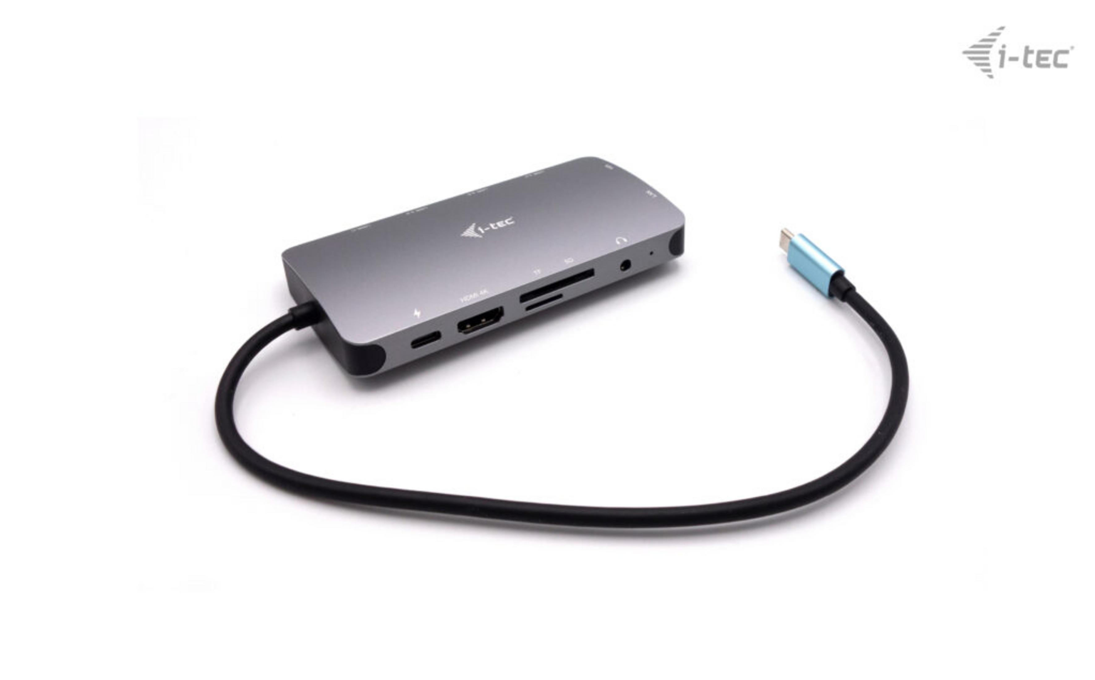 Grauer USB-C Hub mit HDMI, SD-Kartensteckplätzen und Kabel.