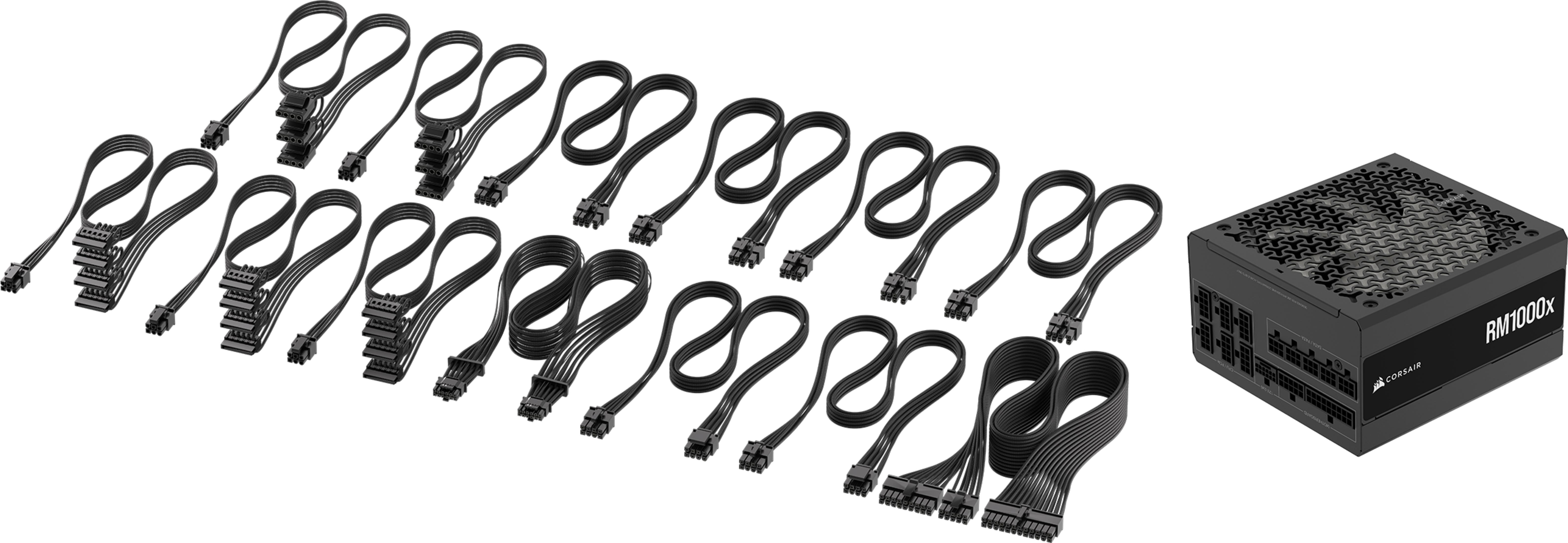 Czarne kable zasilające i czarny zasilacz z kratką wentylacyjną.