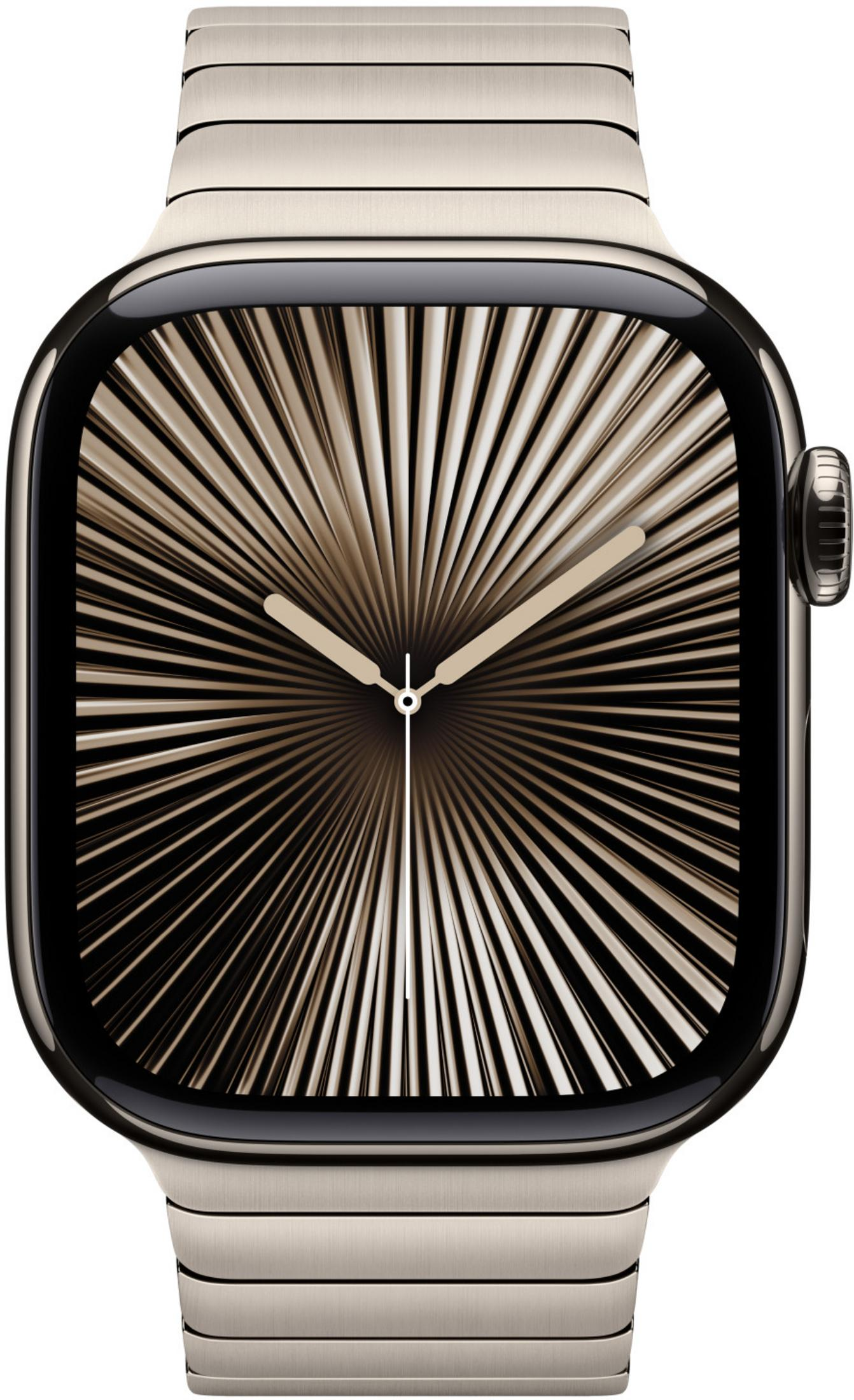 Złoty zegarek z abstrakcyjną tarczą i metalową bransoletą.