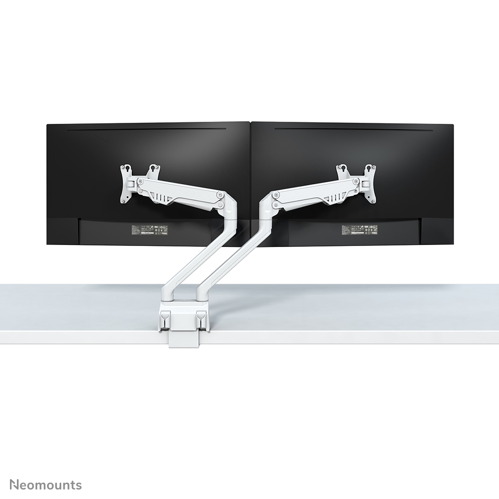 Two white monitor arms hold two black monitors on a white desk.