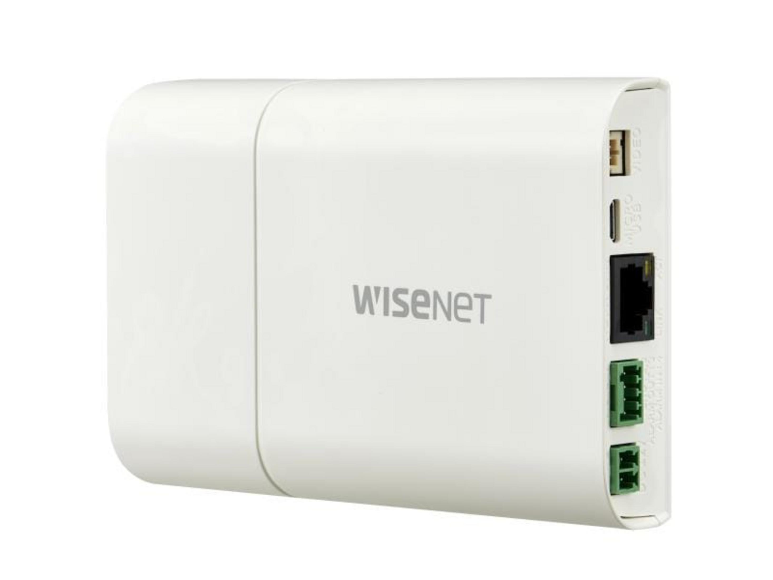 Ein weißes Wisenet-Gerät mit Anschlüssen: Video, Micro-USB, Ethernet und grüne Klemmen.