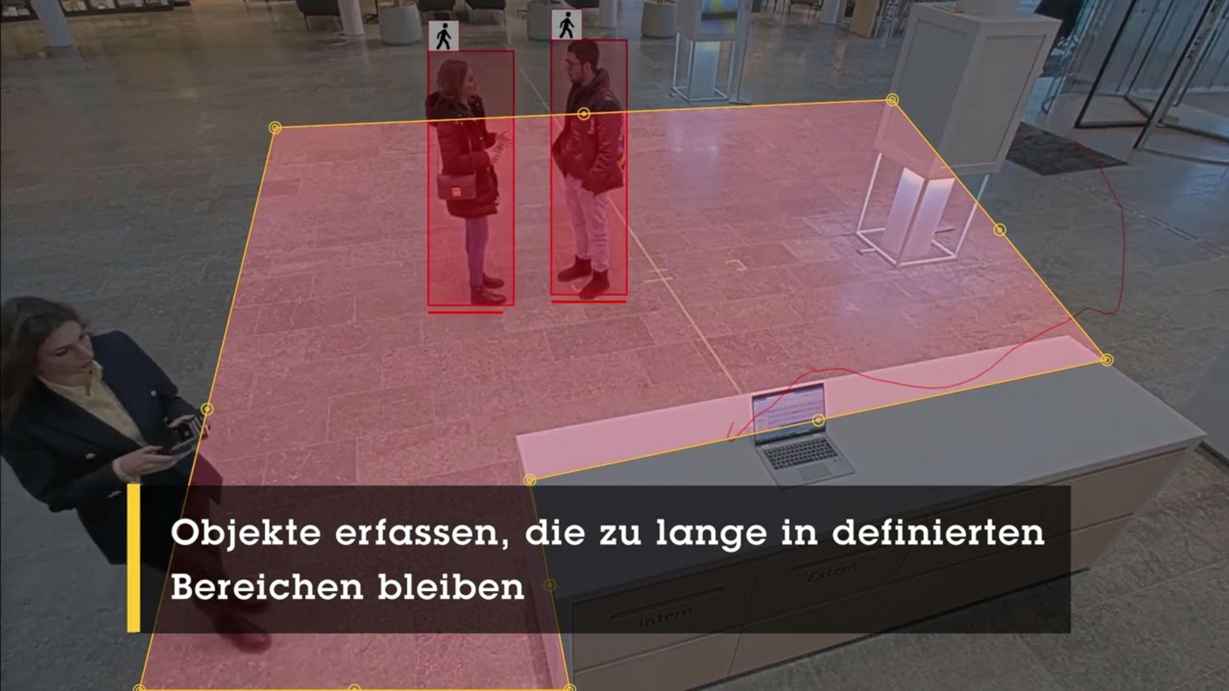 Dwie osoby w czerwonych ramkach wewnątrz, kobieta na pierwszym planie.