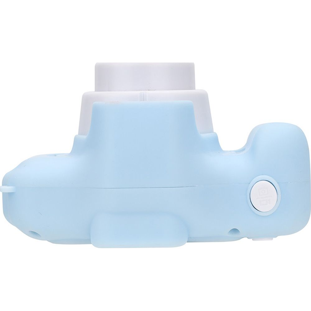 Una fotocamera azzurra con obiettivo bianco. La fotocamera ha la forma di una balena.