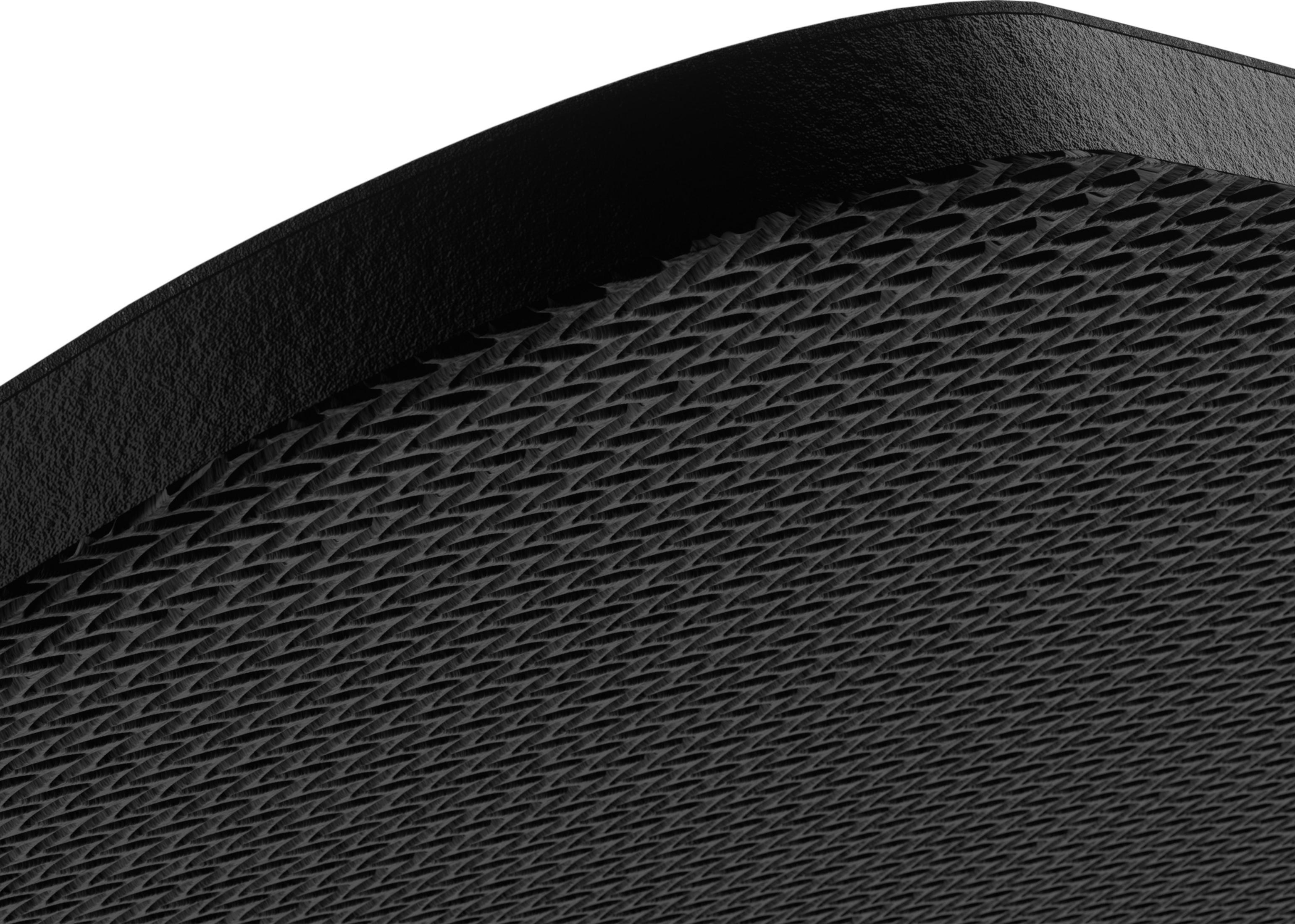 Surface noire texturée à motif losange et bord lisse.
